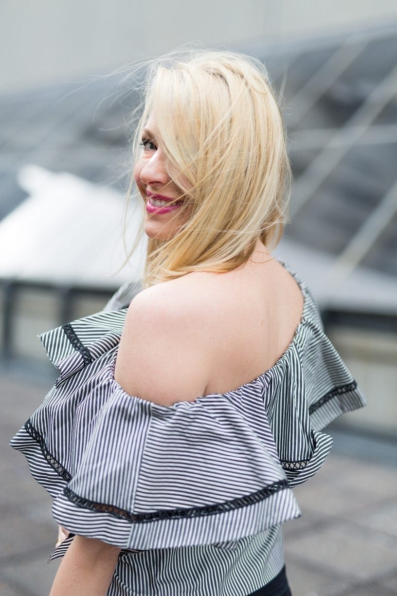 Ruffle off the shoulder shirt.