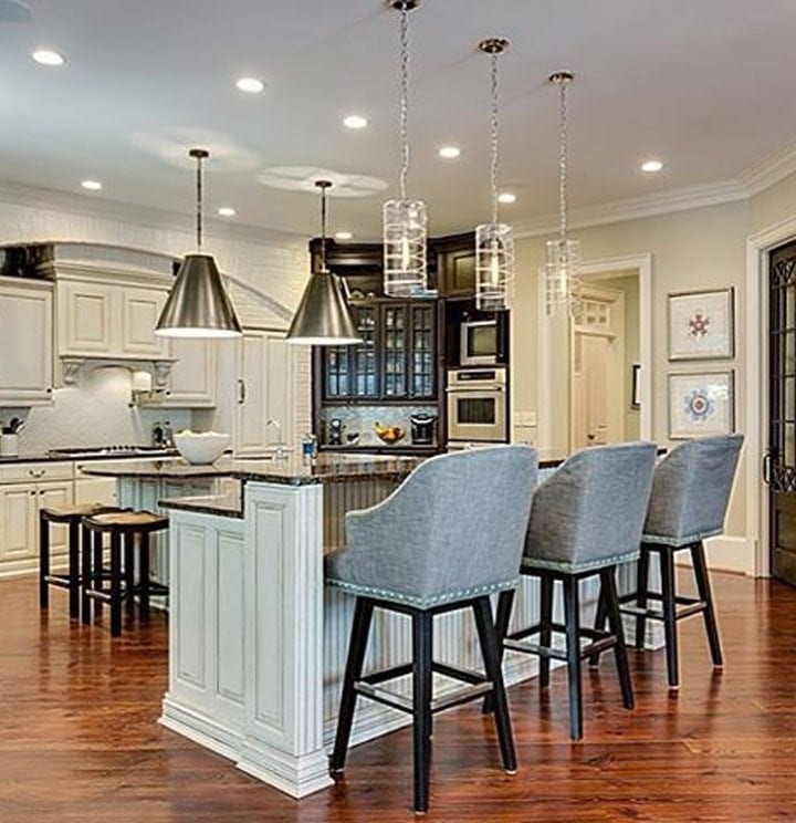 Painted brick in Kitchen. Huntington Beige paint from Benjamin Moore. Glass lighting fixtures.