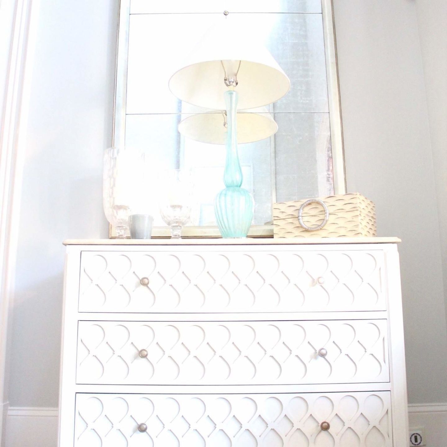 Bright Foyer Decor details. Hall chest with turquoise lamps.