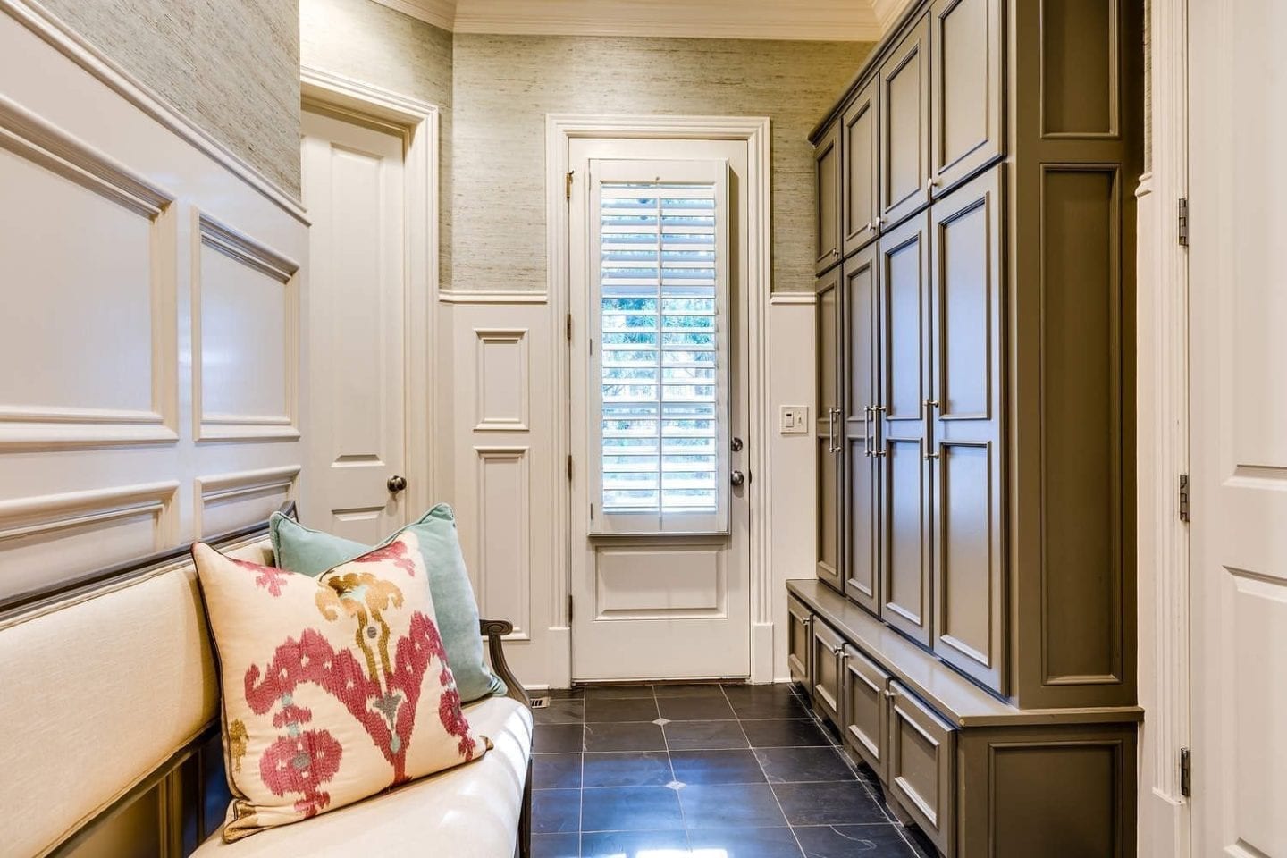 Mudroom design and mudroom built ins for easy storage for backpacks and shoes.