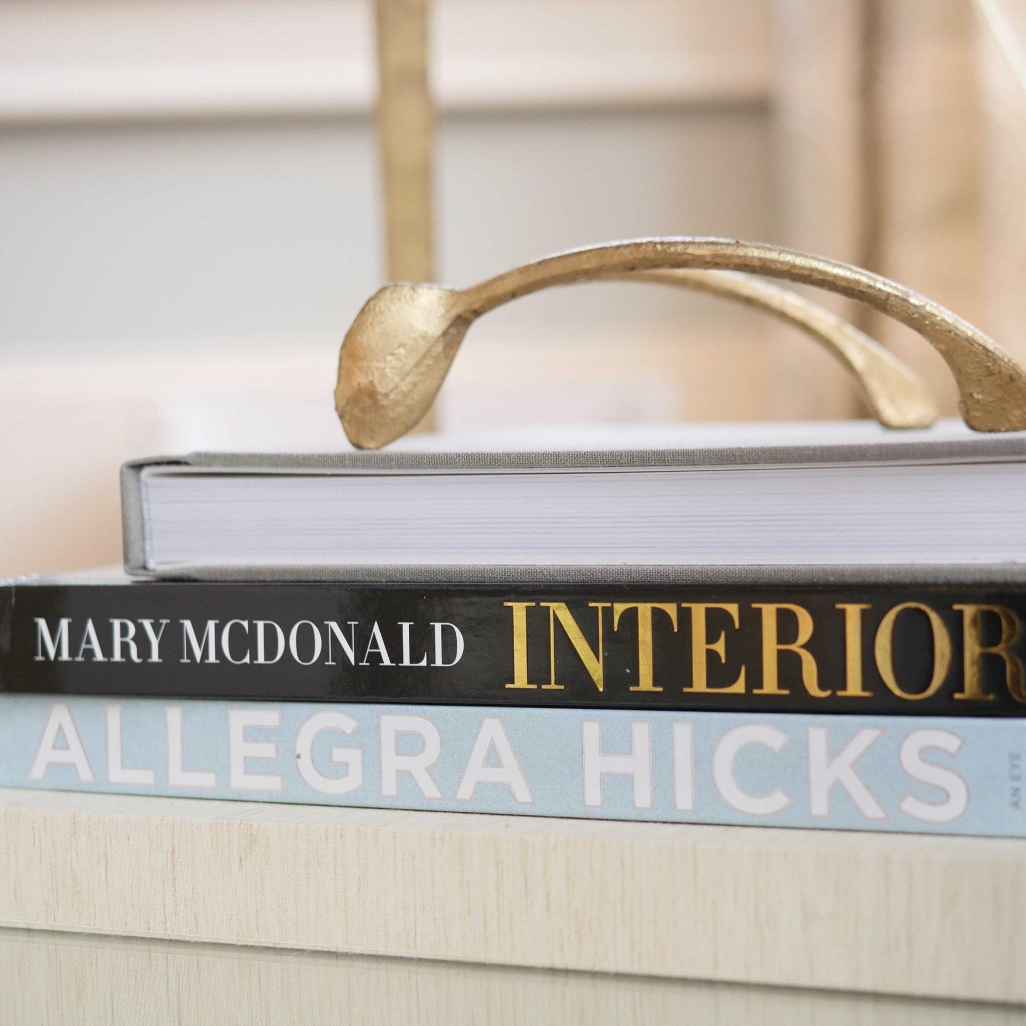 Interior Design Coffee Table Books and horseshoe gold decor.