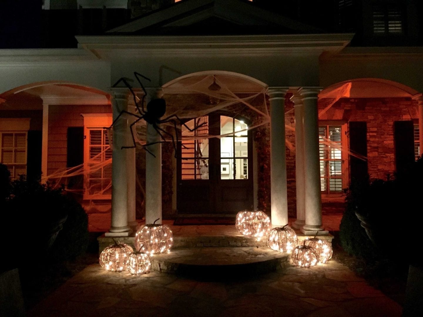 Outside house with orange lights.
