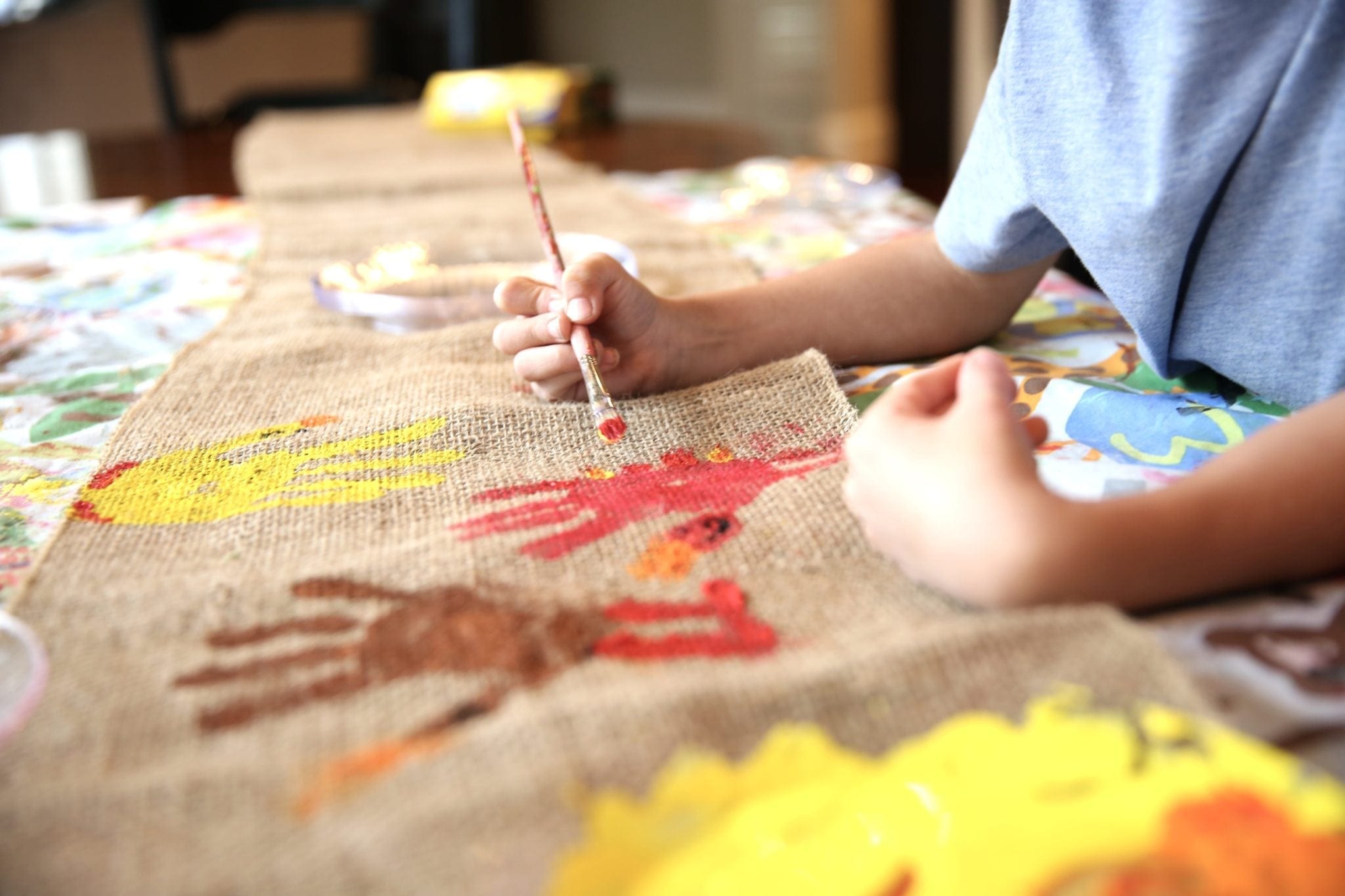 Thanksgiving table runner for kids. A cute Thanksgiving craft that is easy and inexpensive!