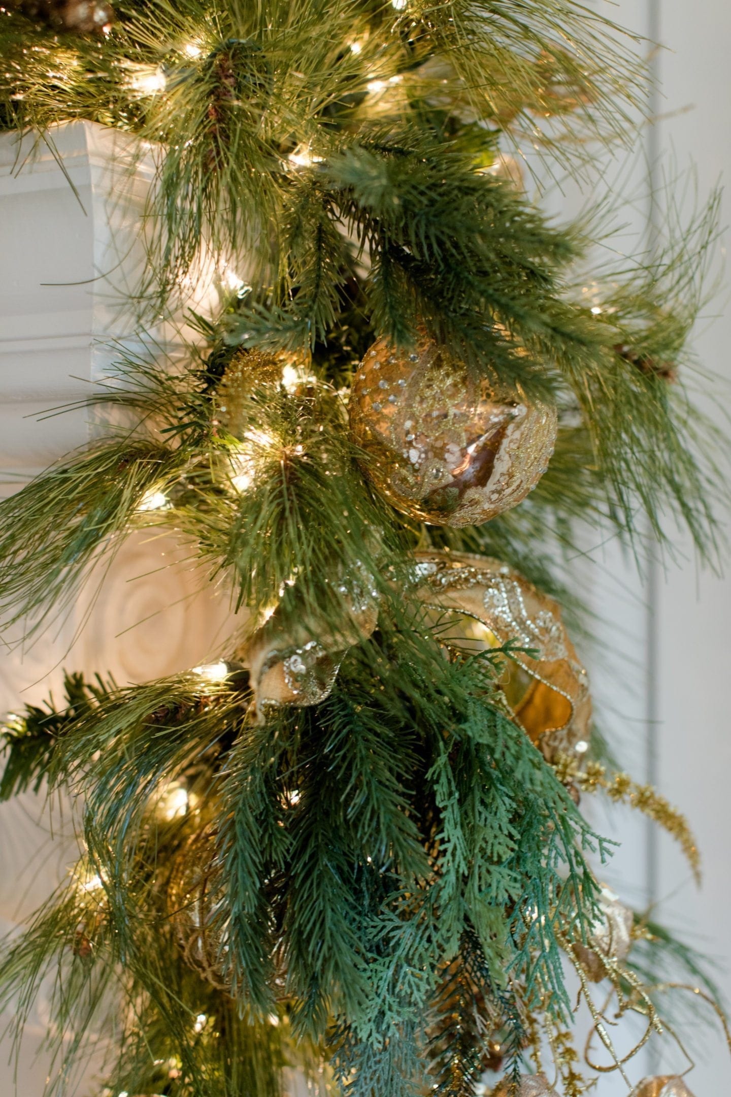 Christmas Garland with Gold Ornaments and Gold Ribbon.