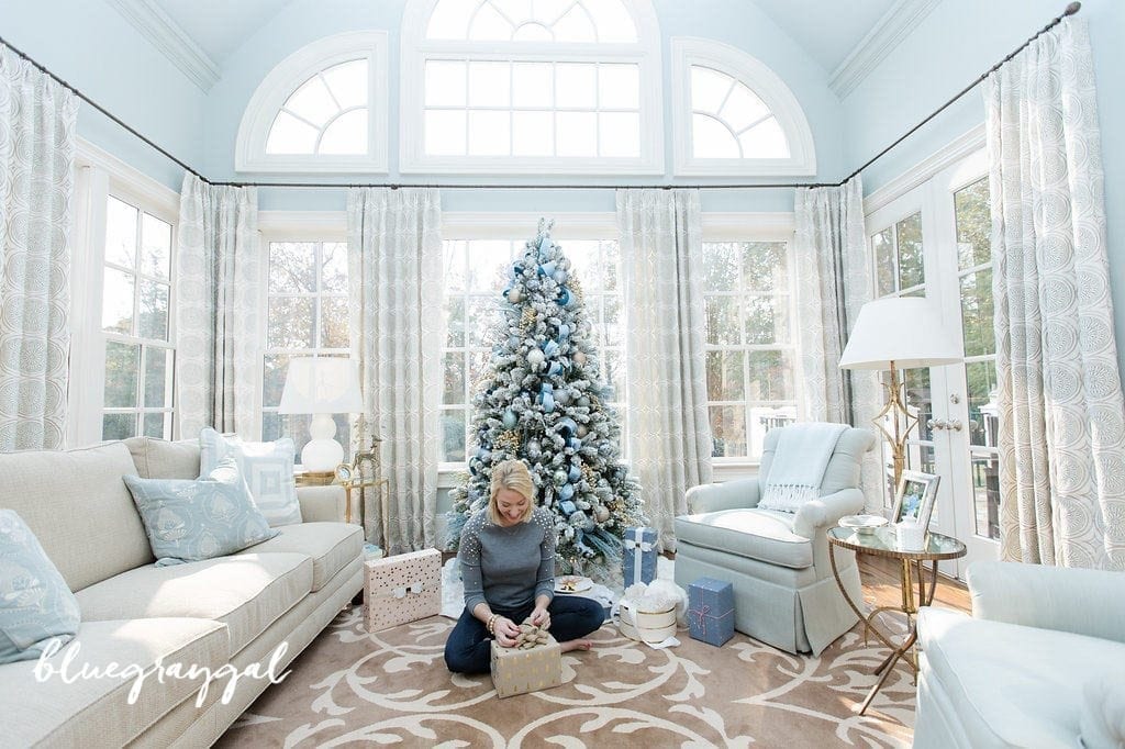 bluegraygal wrapping presents beneath christmas tree in her home