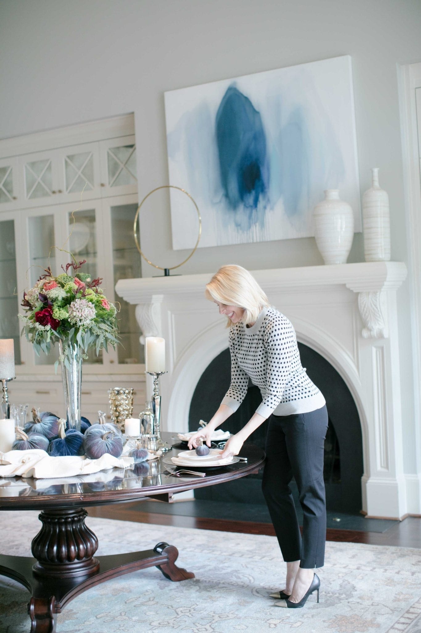 Formal dining room decor. Round table with oversized white mantel. Lifestyle blogger Kelly Page for bluegraygal.