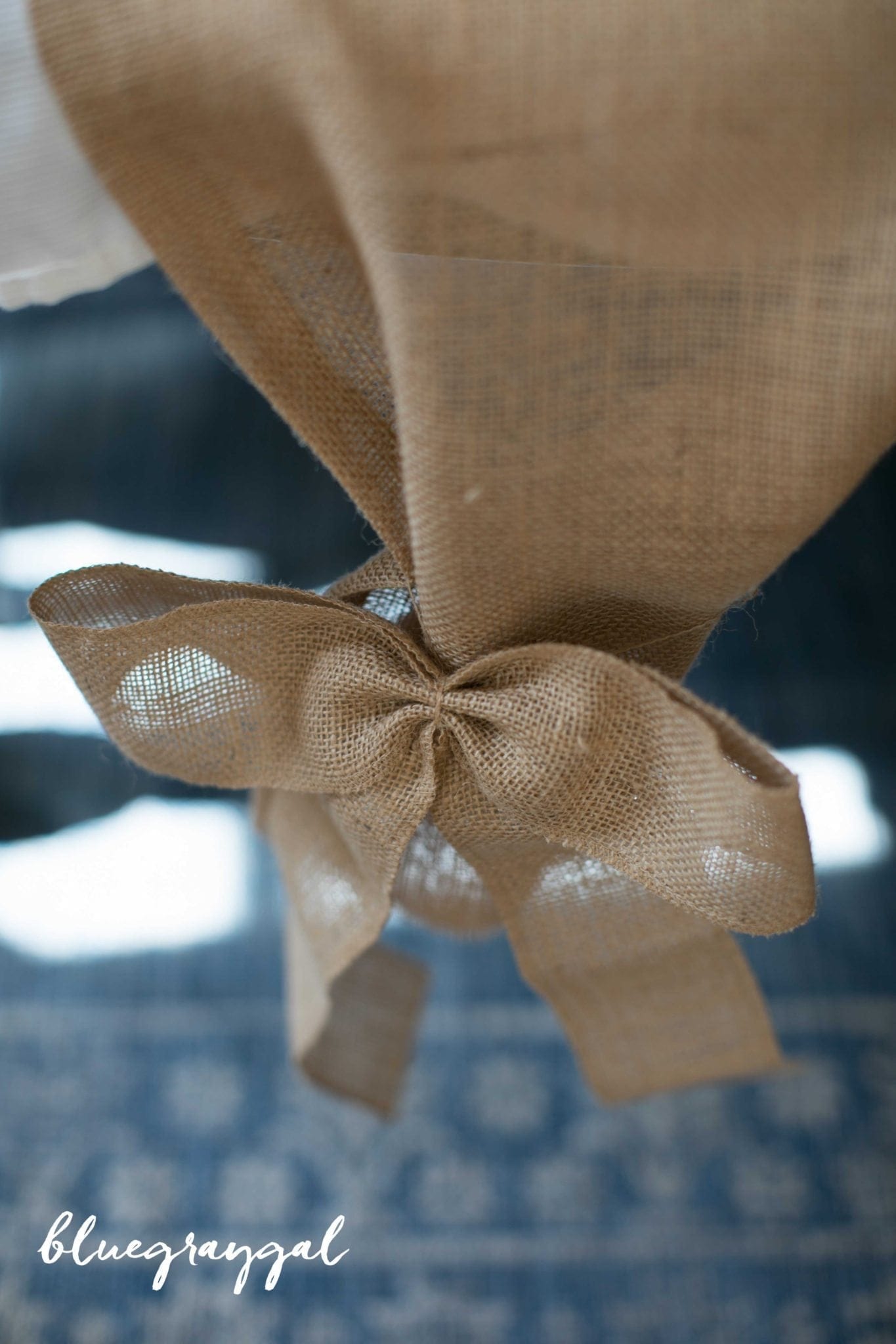 burlap table runner with bow on it