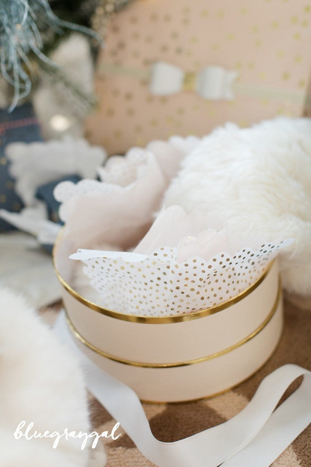 pink and gold gift box with white and gold tissue paper