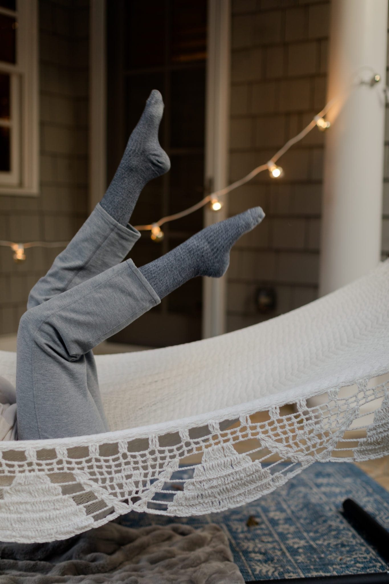 Grey Knee Socks and Hammock with Outdoor Cafe Lights.