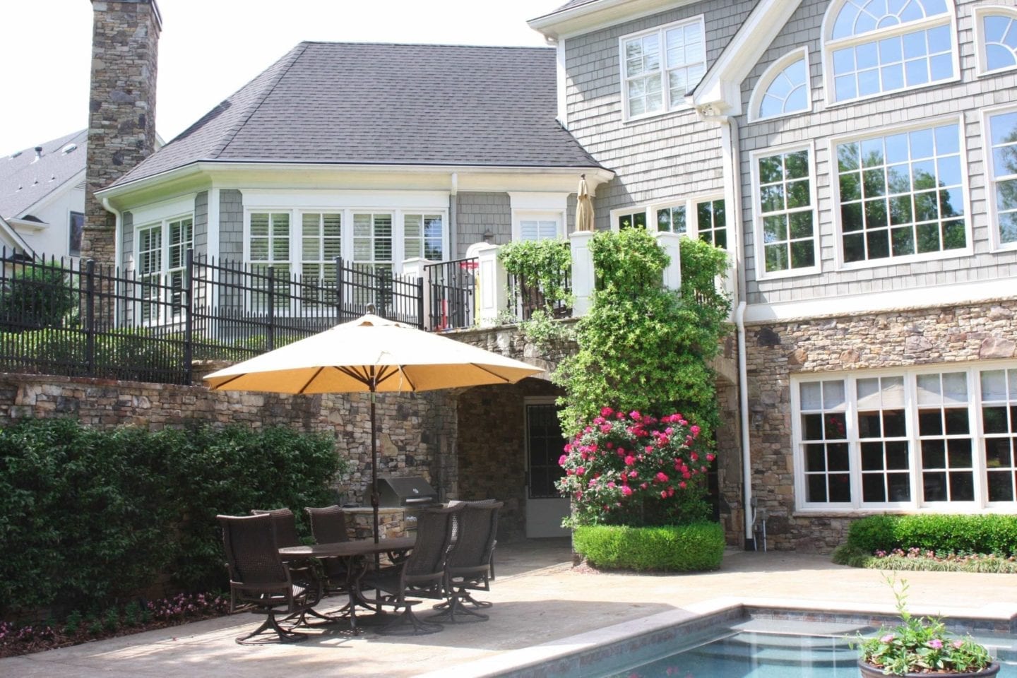 Create a backyard oasis with tropitone Montreux Dining Chair and Tropitone dining table. Lifestyle blogger BlueGrayGal shows how she uses Tropitone Montreux chairs and dining table to create a warm landscape design.