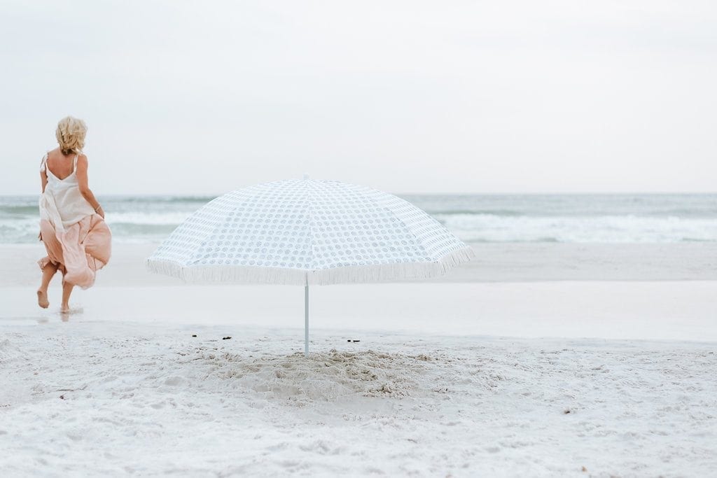 Beach umbrella with fringe.