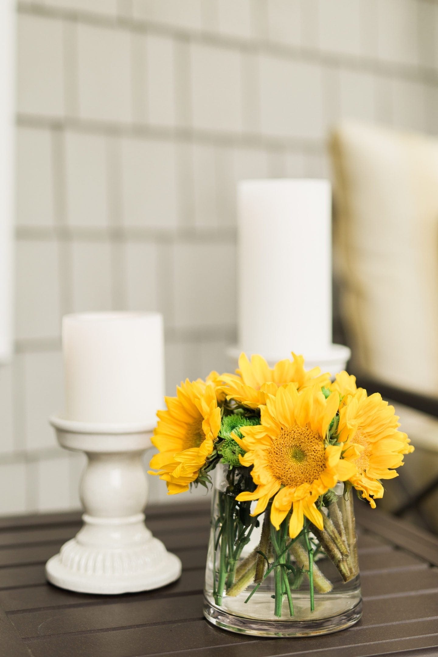 Sunflower Flower Arrangement with silk flowers and white Pottery Barn candlesticks.