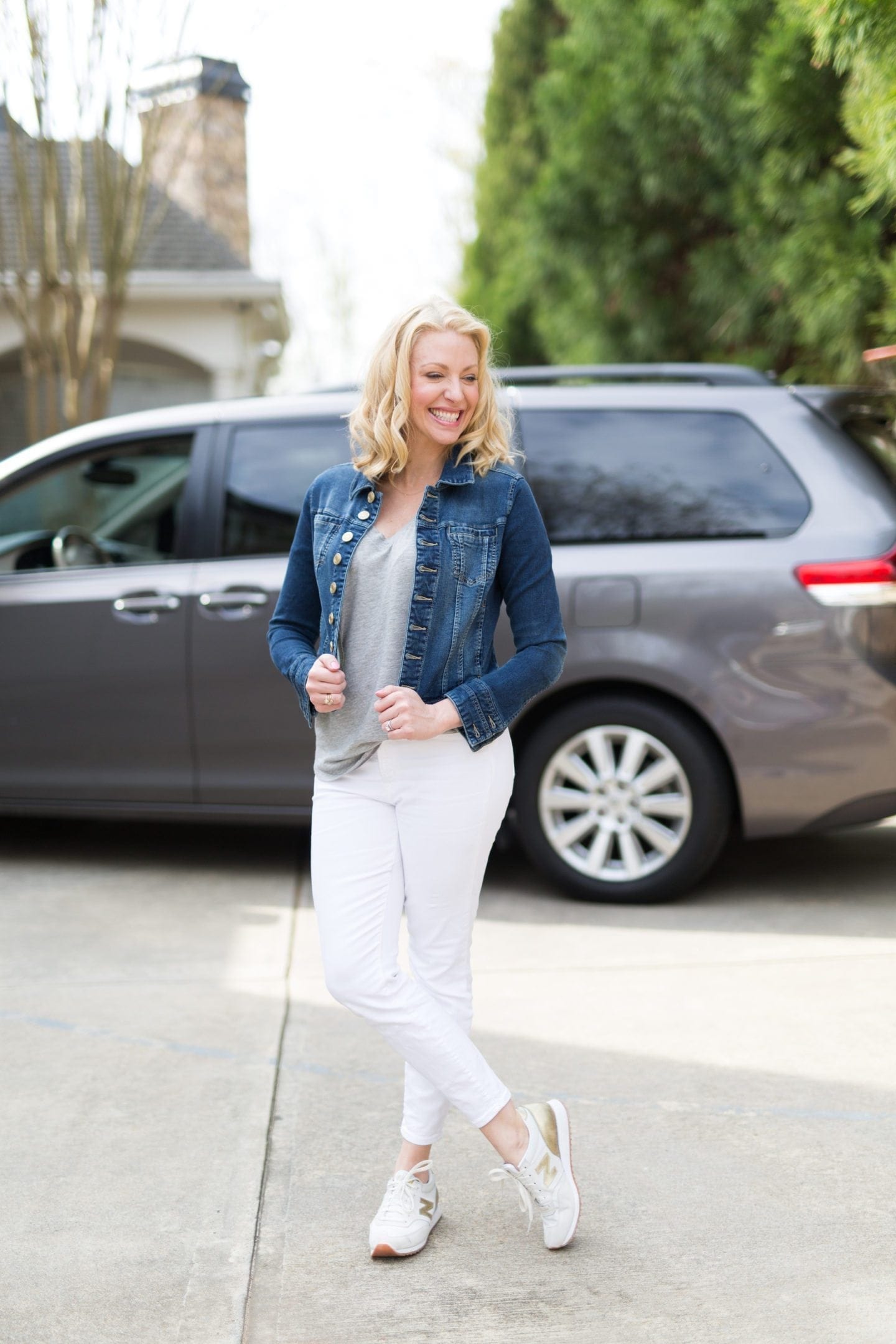 Crop Jean jacket outfit with white jeans and white and gold metallic sneakers. Easy everyday casual outfit for spring!