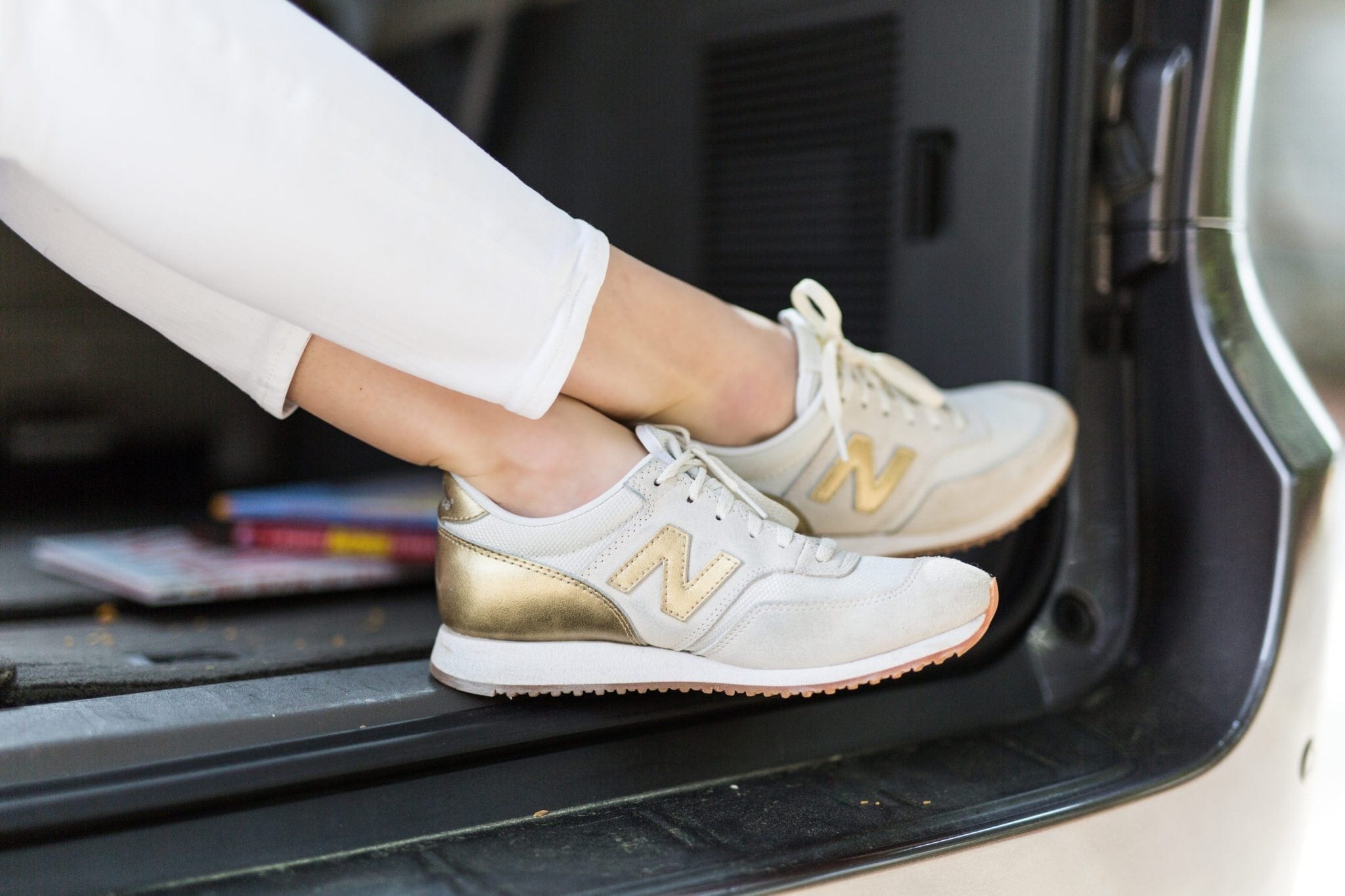 gold and white tennis shoes. New Balance shoes from J Crew on sale.