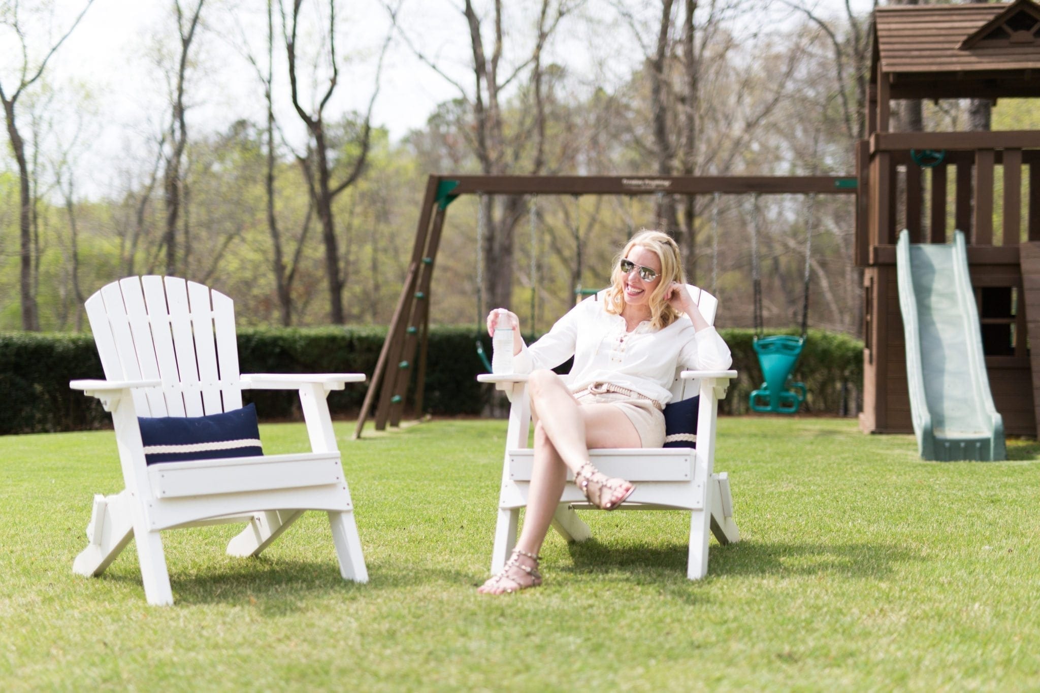 Adirondack chairs for backyard. Blue outdoor pillows. Valentino Rockstud sandals.