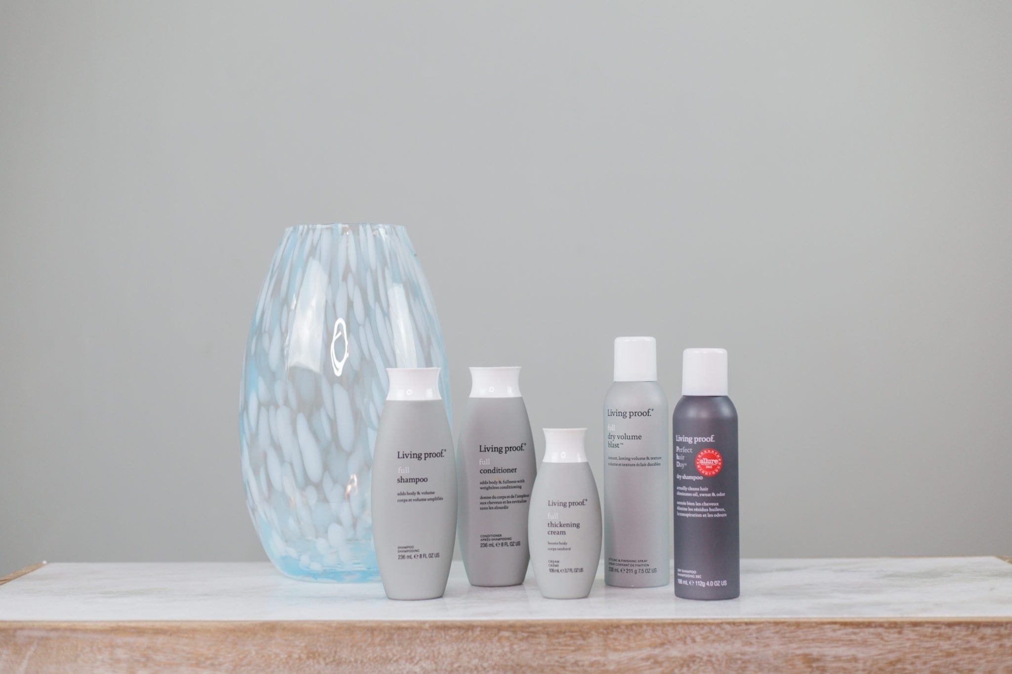 Easy top knot tutorial. Living Proof hair care line. This is a great shampoo to create volume for people with straight hair. Add volume to straight hair with these products from Living Proof. My hair doesn't usually do anything, but this hair care line has given me lift and volume easily!