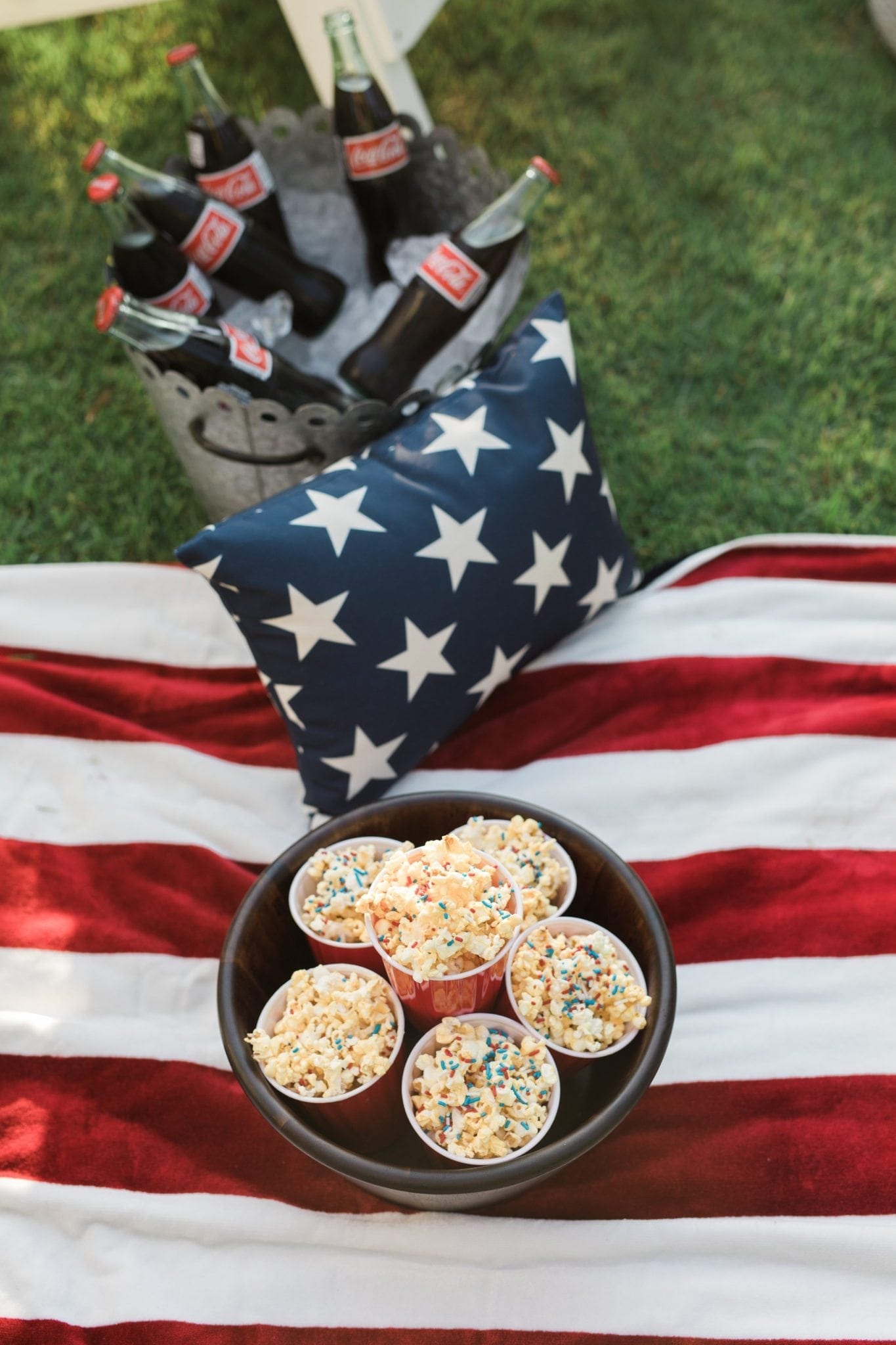 Popcorn with white chocolate and red white and blue sprinkles.