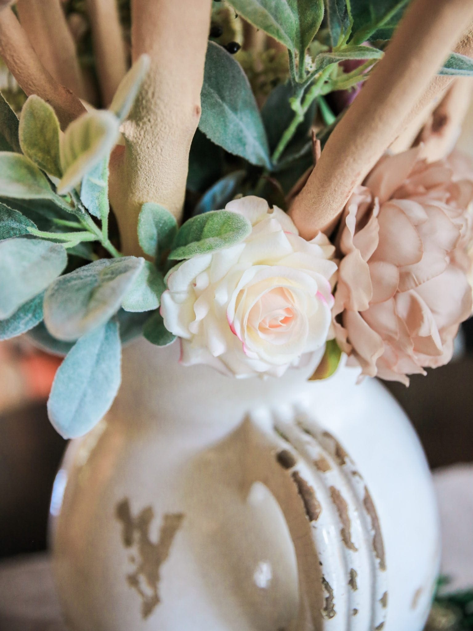 realistic flowers with light cream, and pink roses.