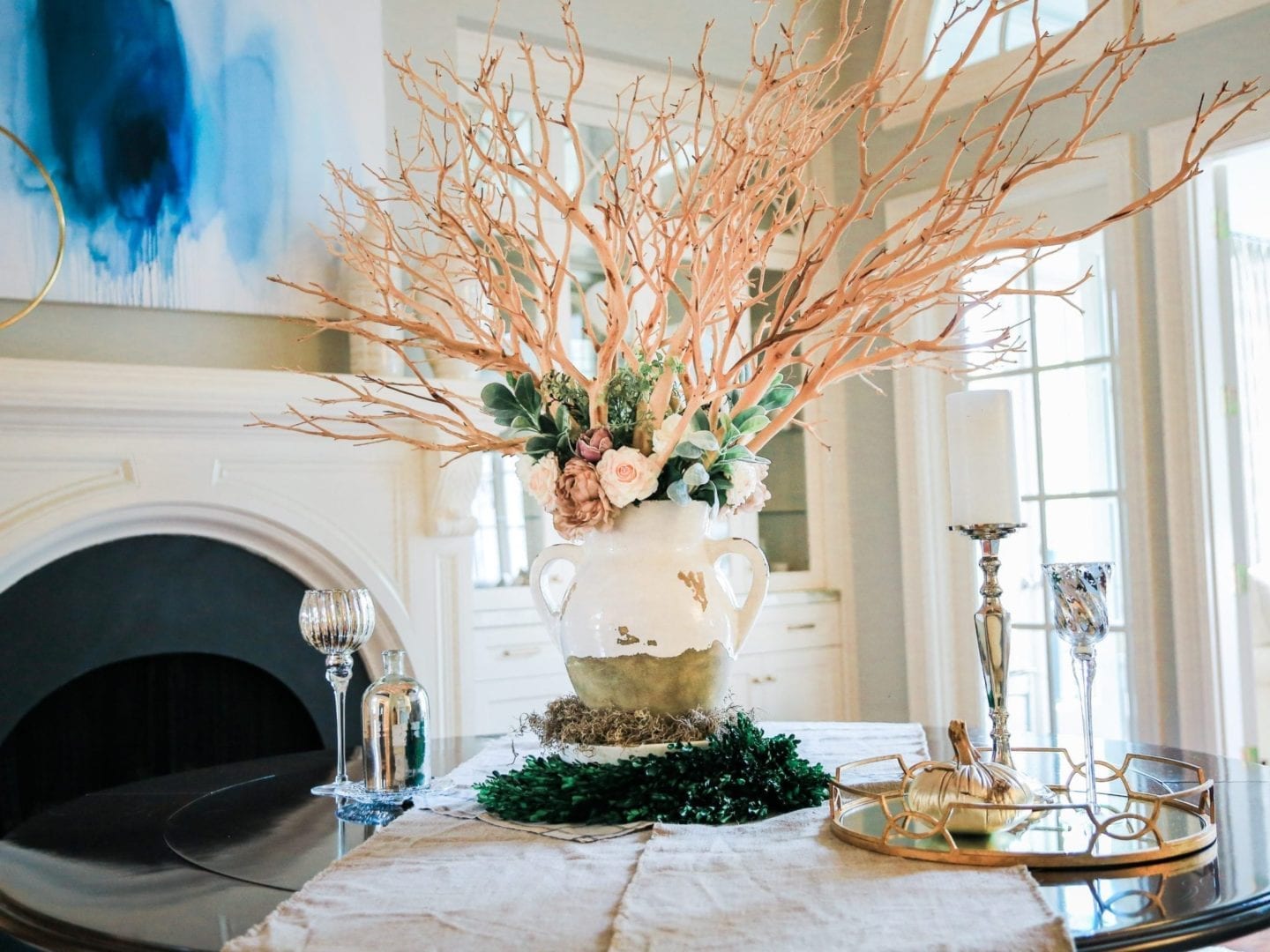 artificial real touch flowers and Pottery Barn Tuscan Urn vase in Dining room centerpiece.