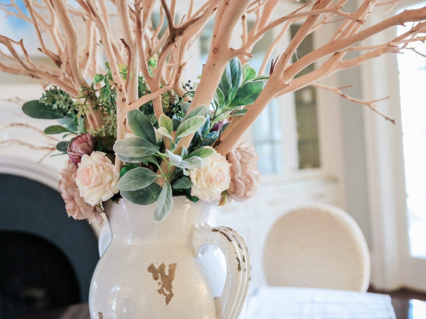 Atlanta blogger - lifestyle blogger creating home centerpiece inspiration with manzanita branches in dining room.