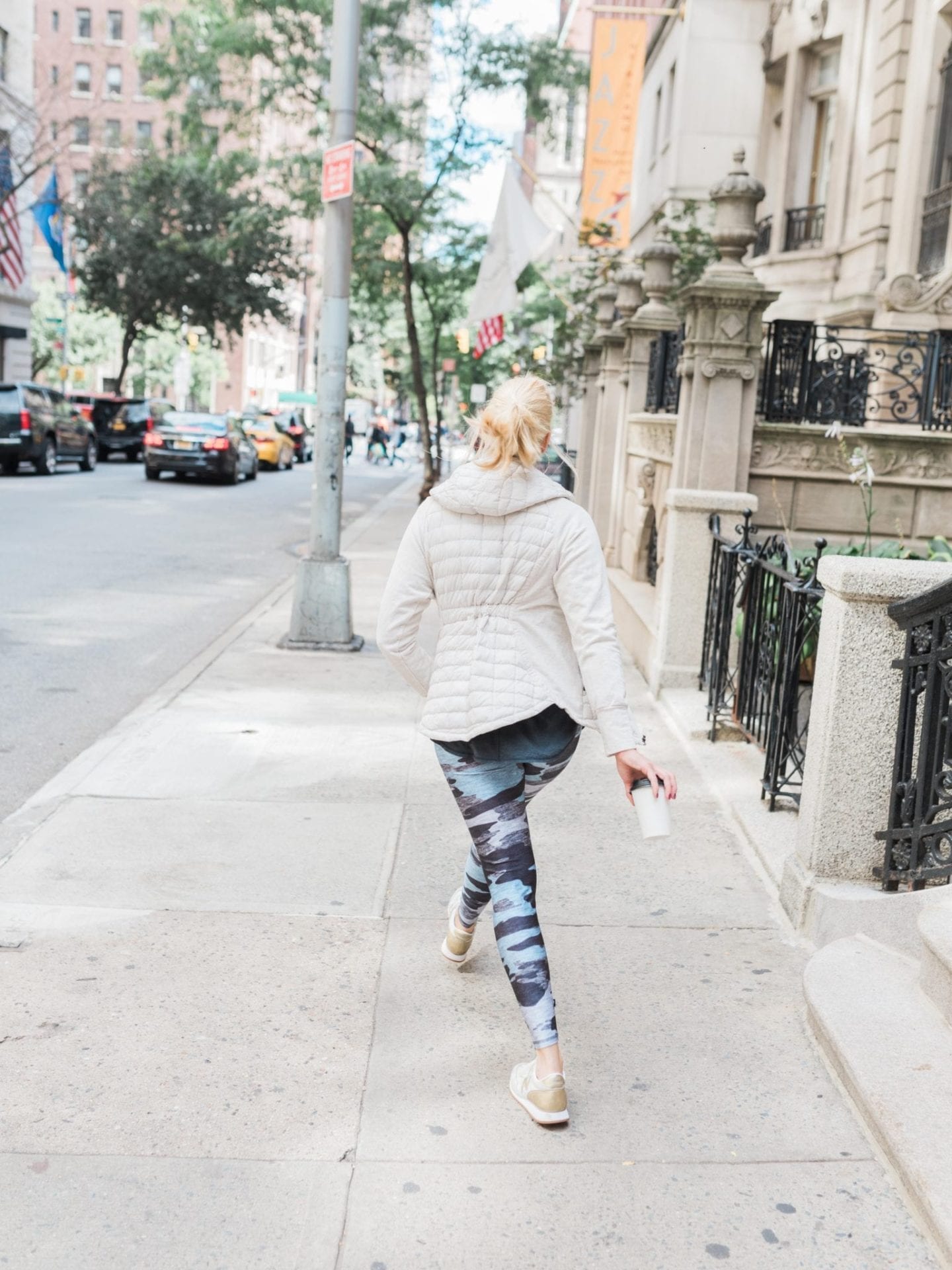 Womens Northface Jacket with Hood on cute exercise leggings for women. Camo work out leggings.