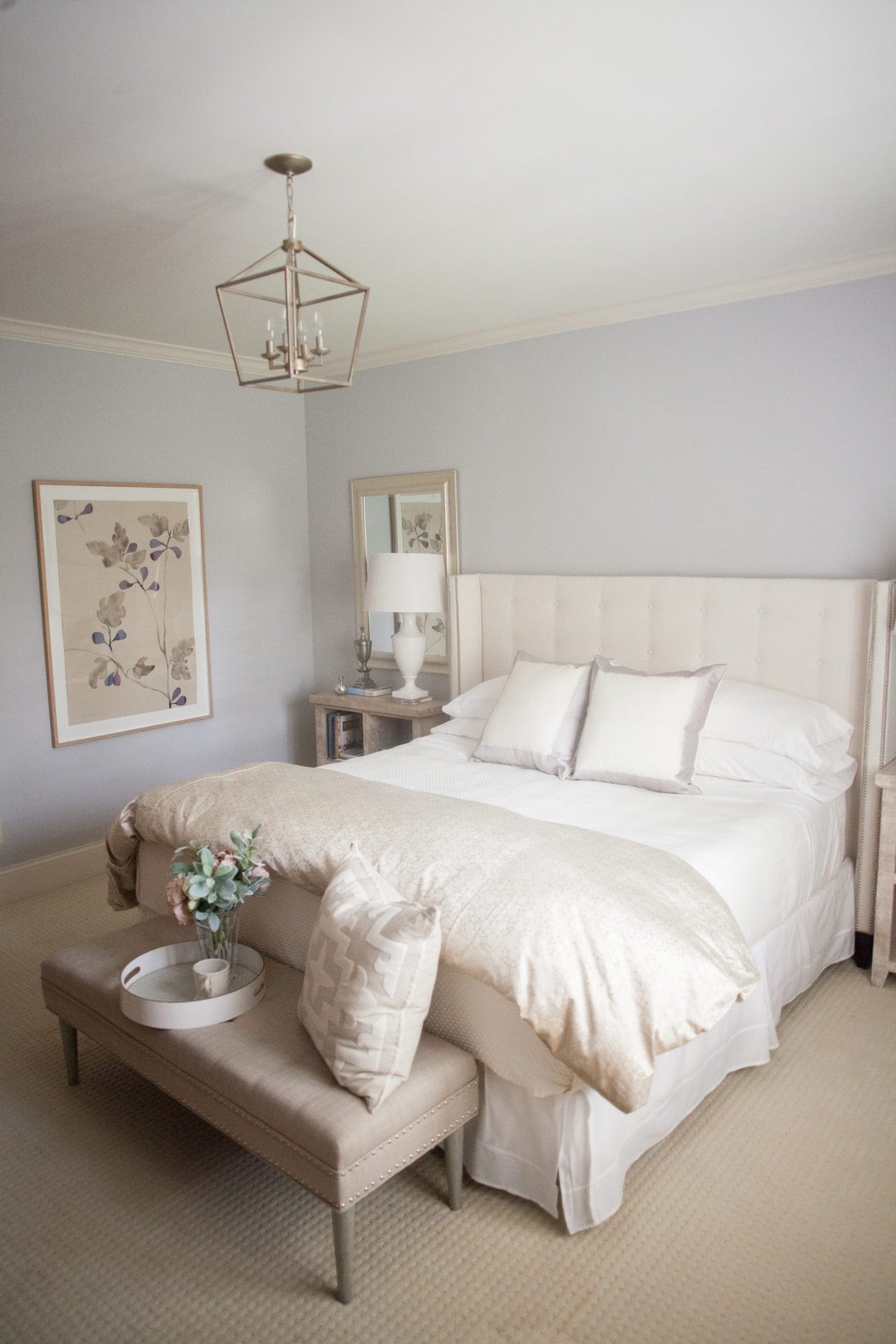 Bedroom decorated in ivory and pale lavender.
