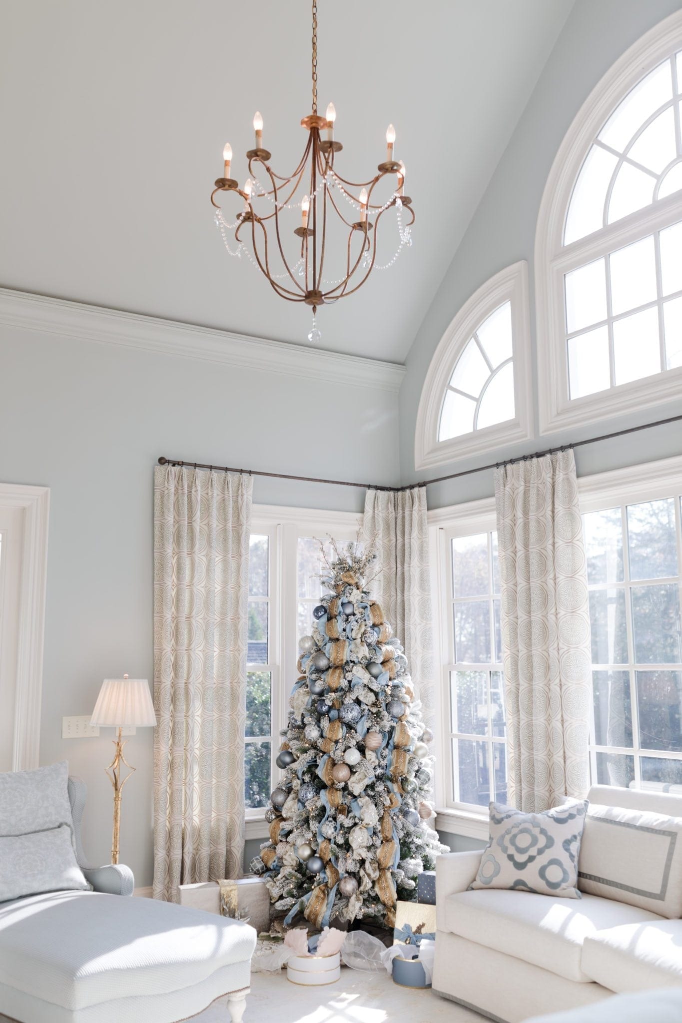 Best artificial trees and how to find a good one. Light blue and gold Christmas tree.