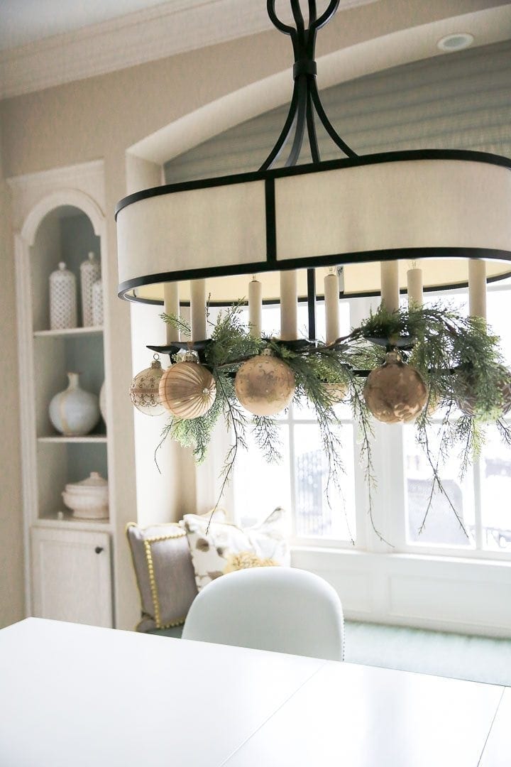 How to hang ornaments from a light fixture.