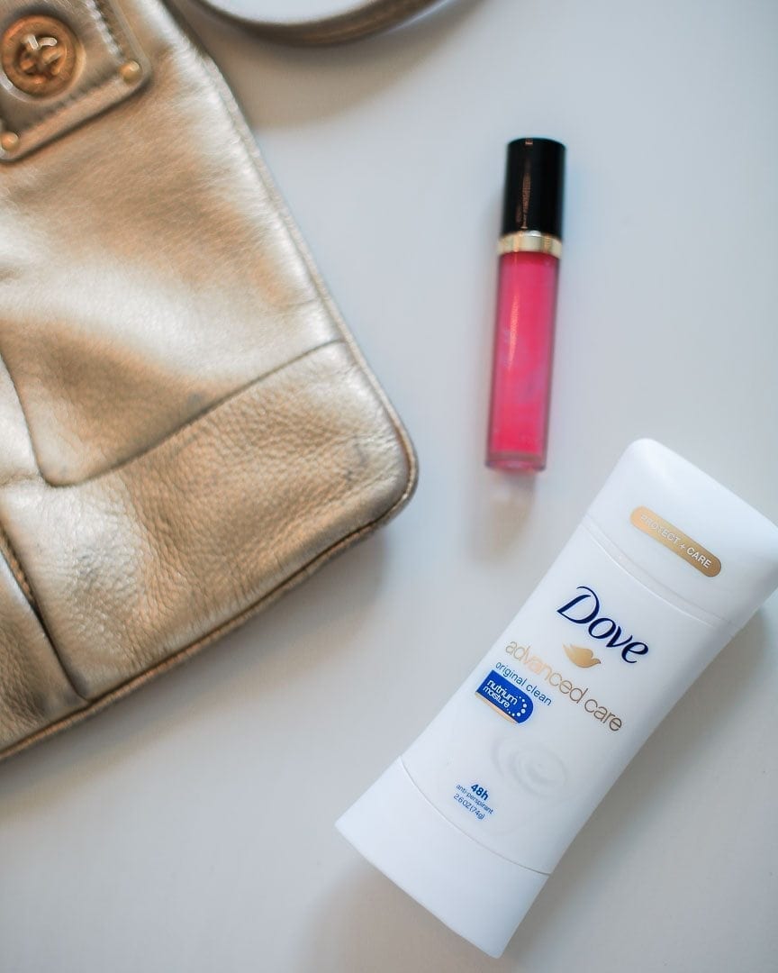 What I keep in my gold cross body bag during the winter. Pink Lipstick and my favorite antiperspirant, Dove Advanced Care.