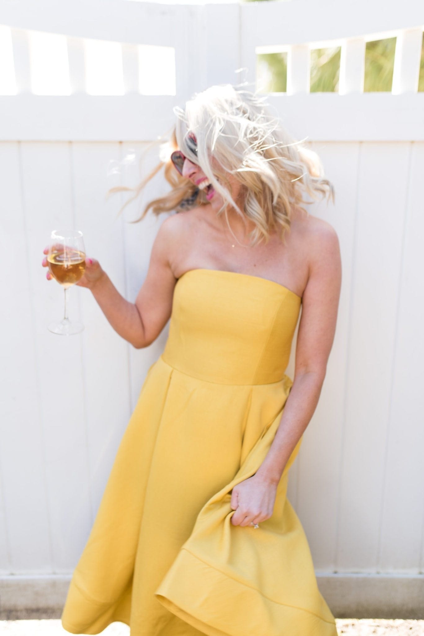 Strapless Yellow dress with full skirt. Red sunglasses. My long hair (and my sisters!) stays healthy thanks to the the T3 curling iron, T3 straightener, and T3 curling wand!
