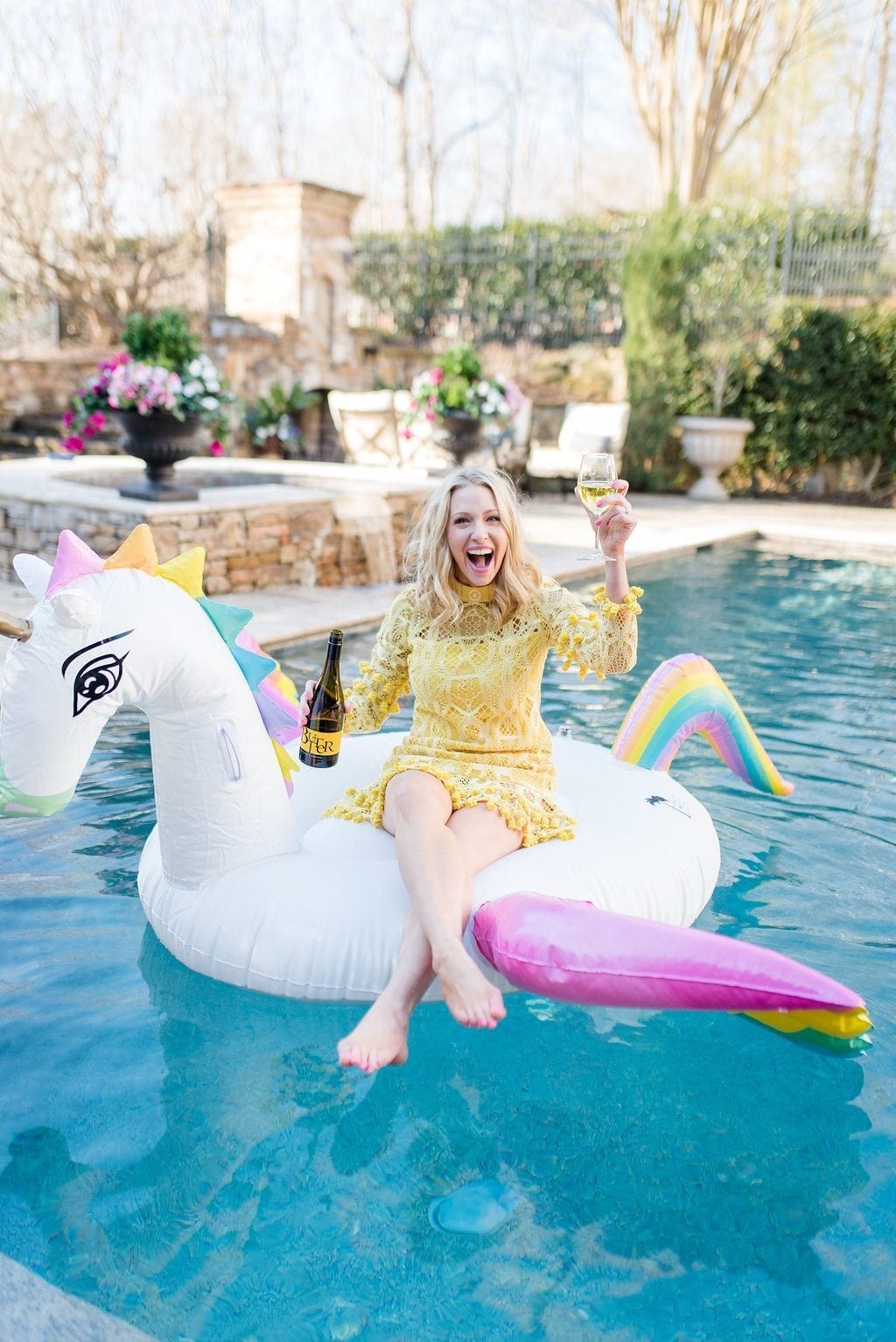 My huge pool float in the shape of a rainbow unicorn floatie