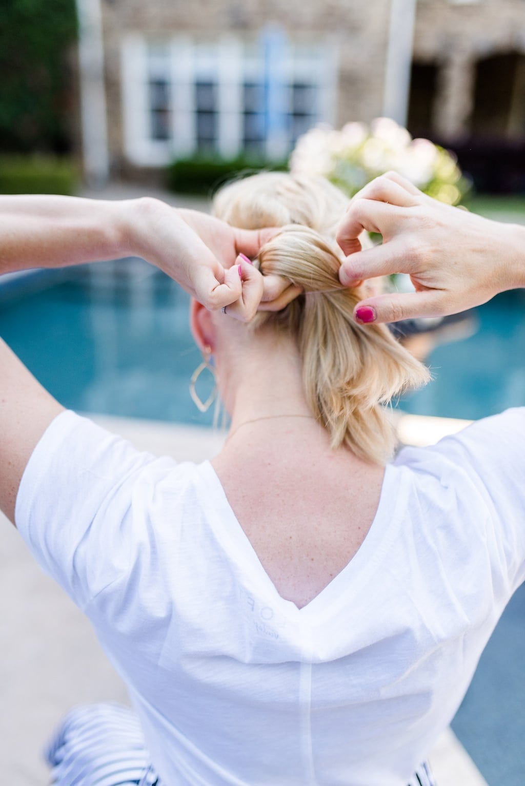 Low bun hairstyle with braids.