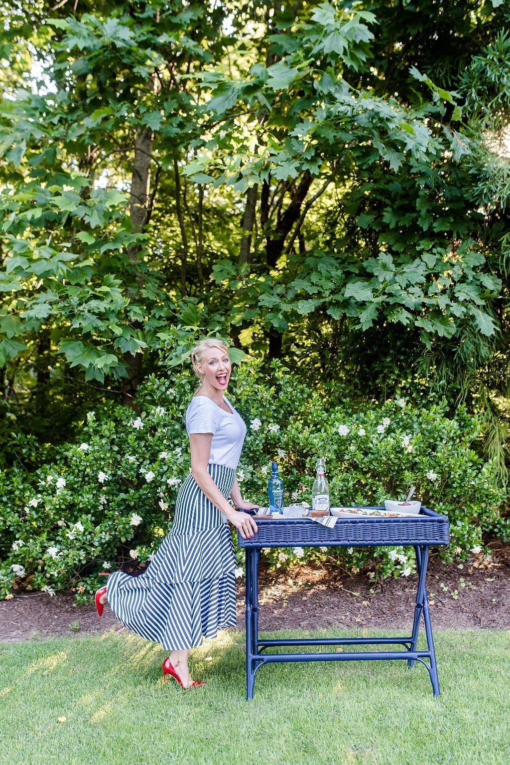 Outdoor entertaining tips from lifestyle blogger, bluegraygal. Gardenia bush and blue bar cart with Pinnacle Vodka.