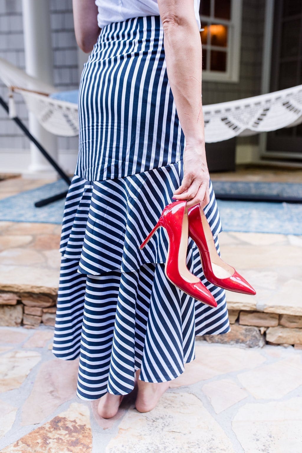 Navy and White striped skirt with red patent leather pumps.