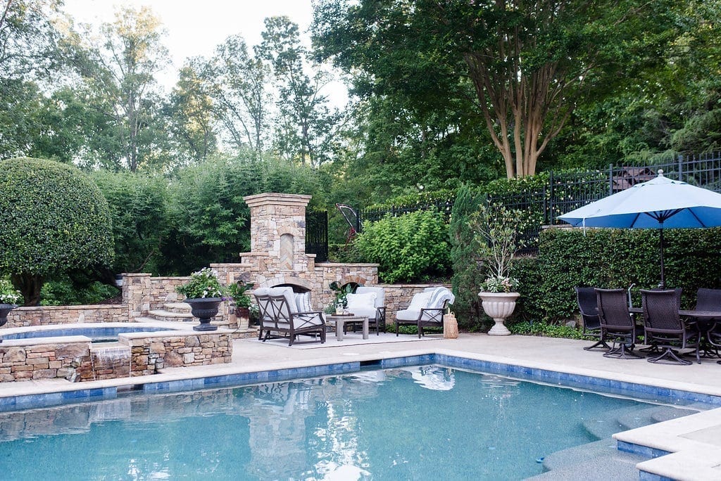 Atlanta backyards and Pebble Tech swimming pool. Outdoor fireplace and landscaping ideas.