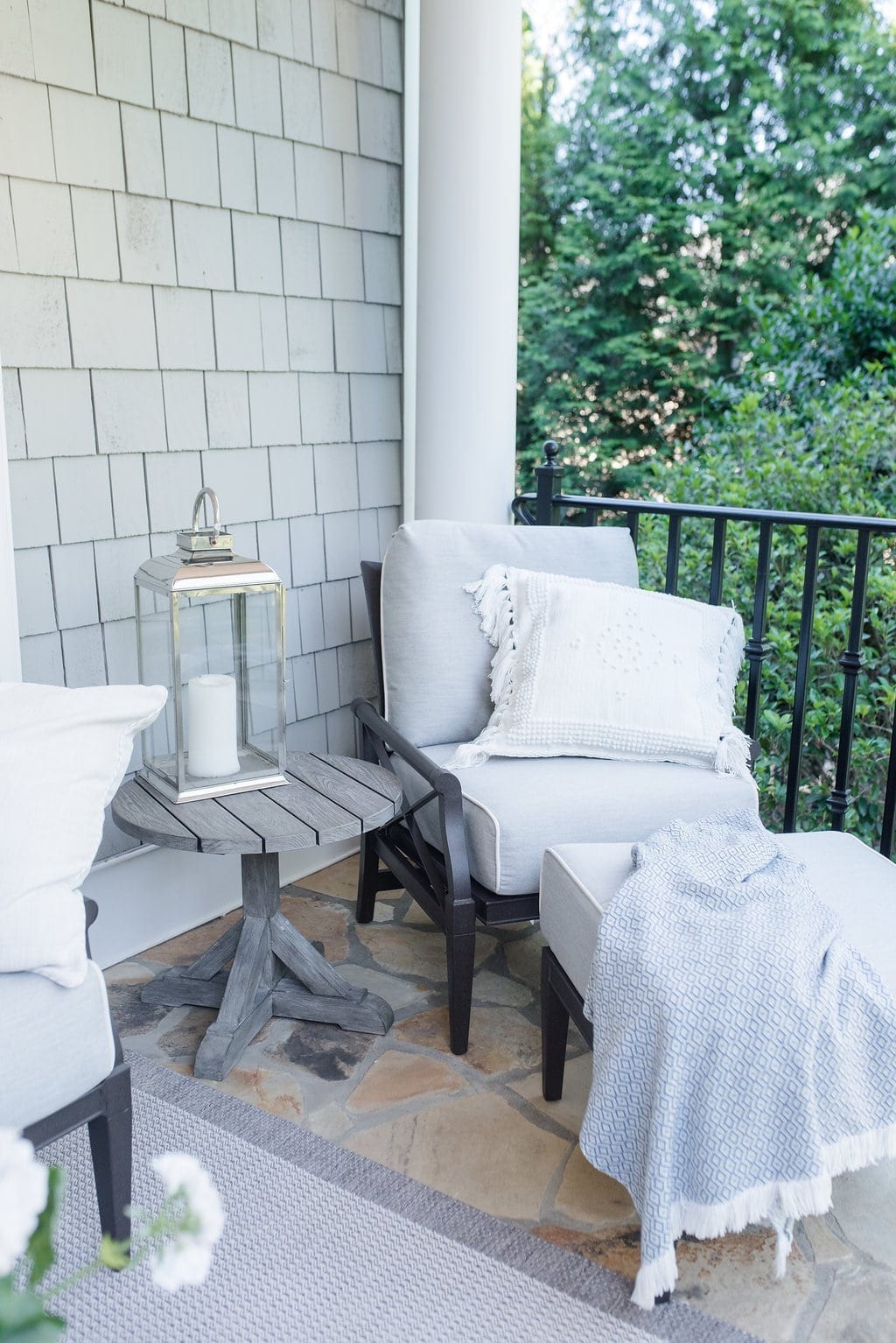 Woodard Outdoor Furniture. Lounge chair that rocks outside and teak side table.