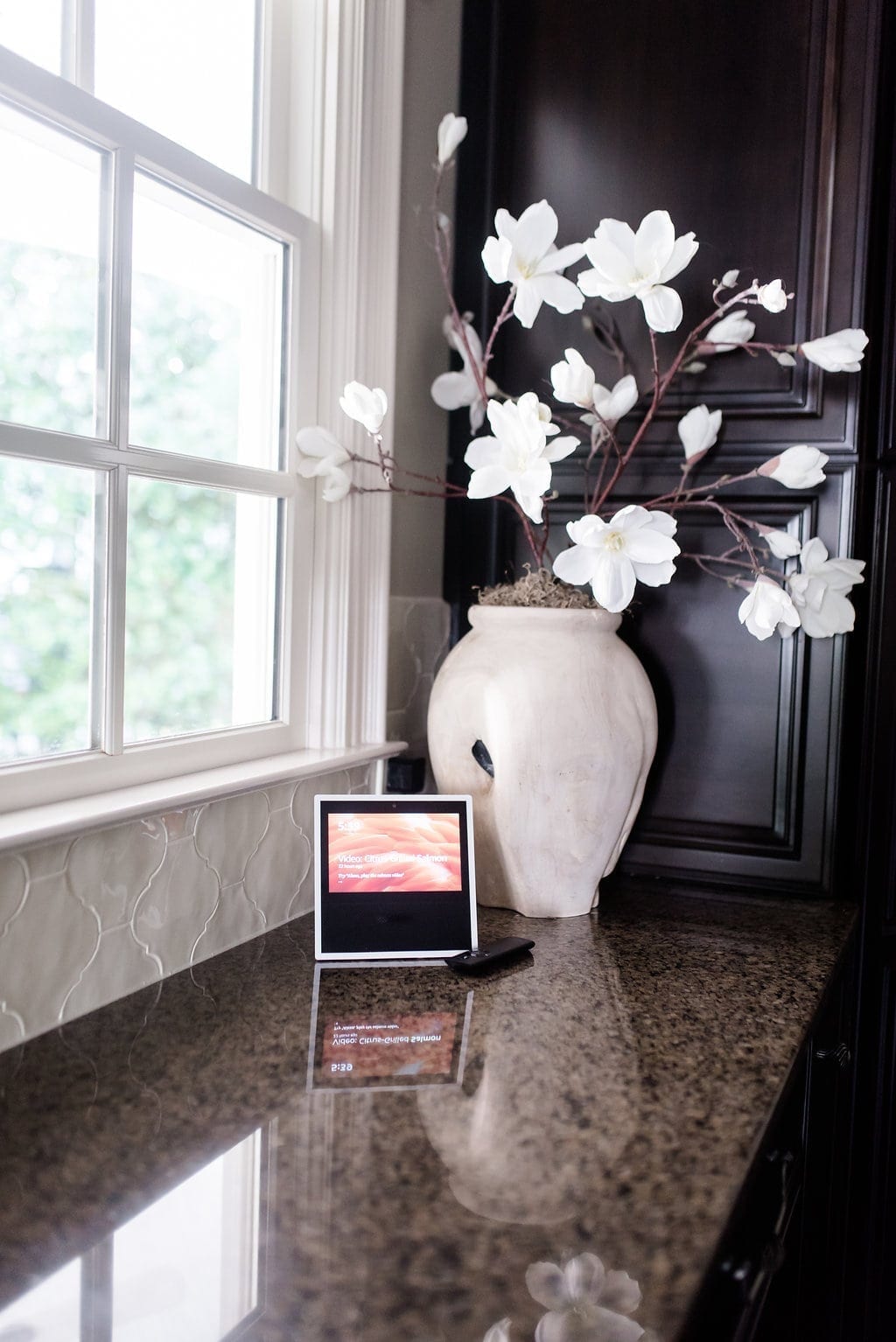 Amazon Alexa Show with wood vase and faux magnolias. 