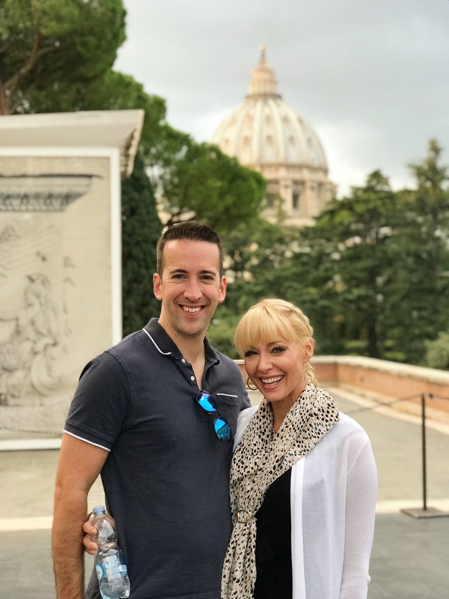 What to wear to the Vatican for women. Cheetah print scarf and white cardigan.