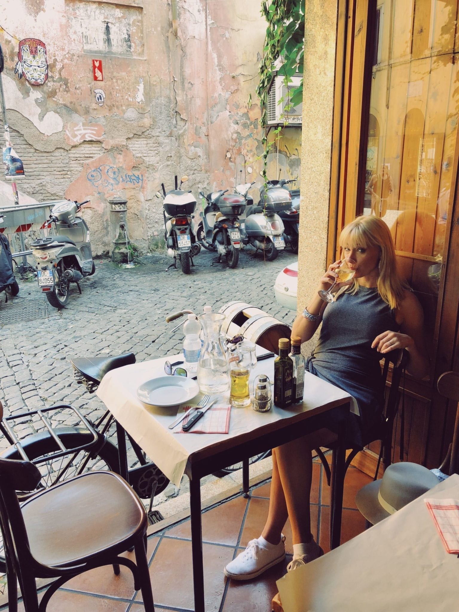 Club Monaco dress for women. How to wear tennis shoes with a dress. What to wear for a trip to Italy. My husband and I spent eight glorious days in Italy. You'll never believe it, but we both carried on! I packed all classic pieces that could be interchanged and dressed fancy, or dressed casually. Here are my 10 wardrobe travel essentials that carried us through different temperatures, settings and experiences!