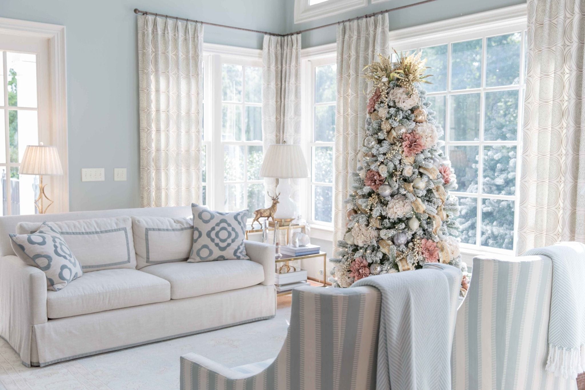 New ideas for 2018 on how to decorate a holiday tree. A pretty tree is decorated in non traditional color scheme.