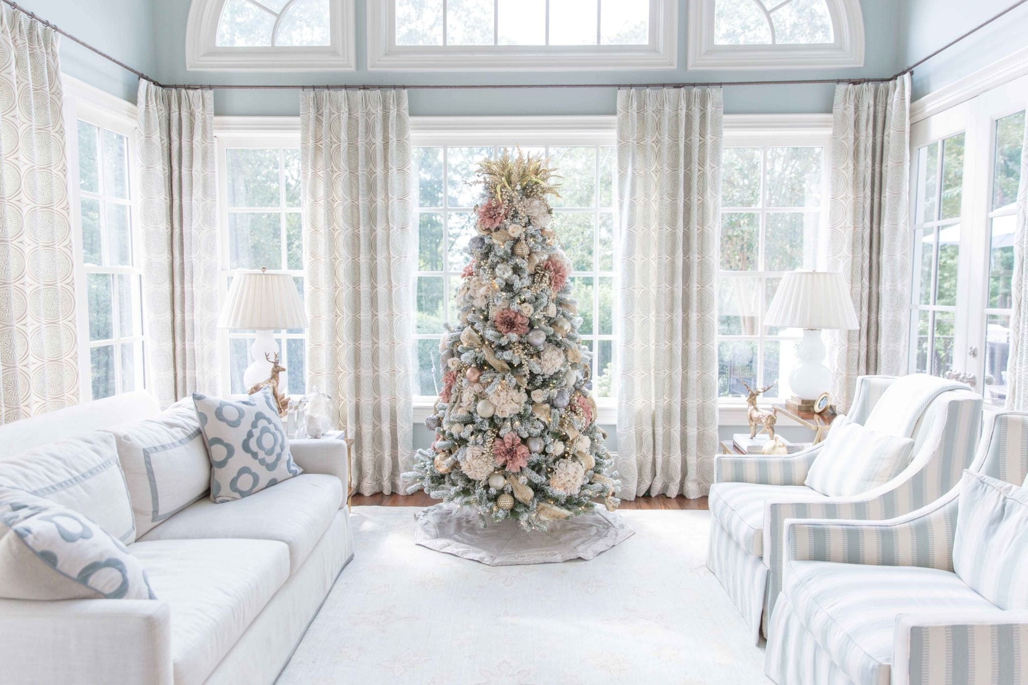 Pink Flocked Christmas Tree. Decorate your Christmas tree with faux flowers, ornate ribbon and stunning Frontgate ornaments. A tree of mauve and ivory is a unique and soft way to decorate your flocked Christmas Tree! Lots of Christmas Tree ideas coming this year!