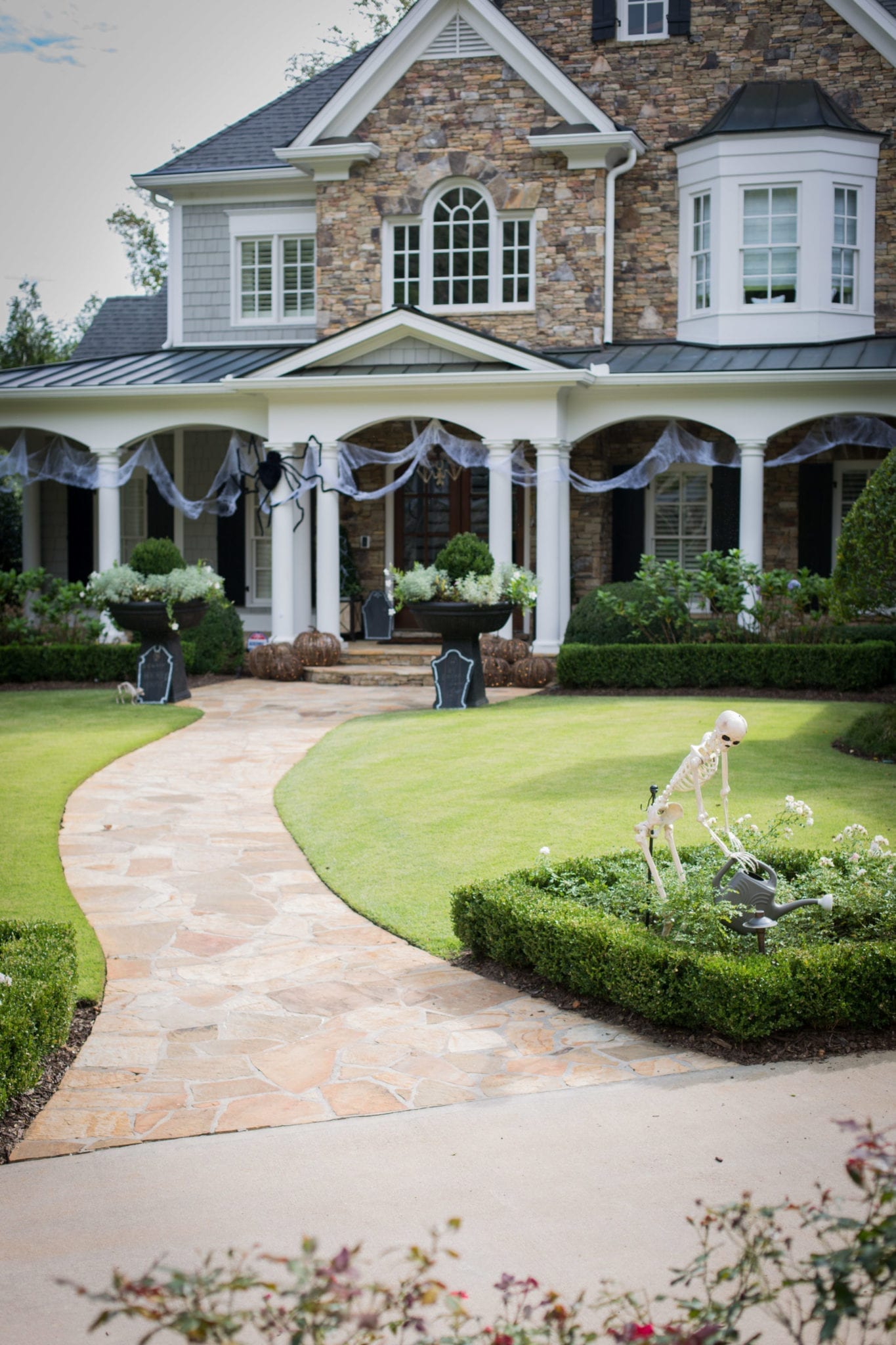 Outdoor Halloween Decorations. Skeleton decorations, spider web and non-spooky ways to decorate your home for October.