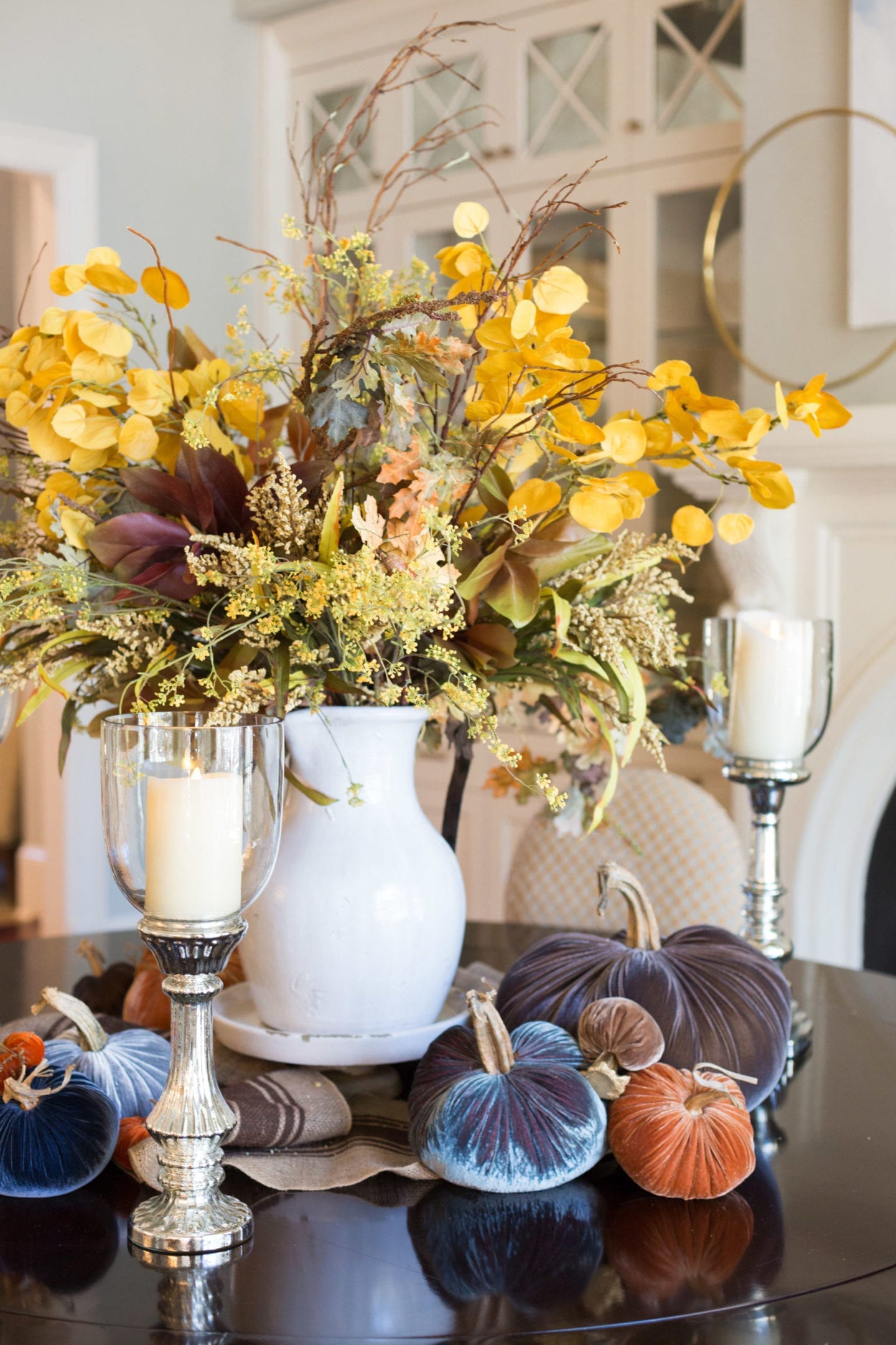 Rustic Fall Tablescape. Thanksgiving flower Centerpieces with faux fall flower arrangements in Tuscan Urn.