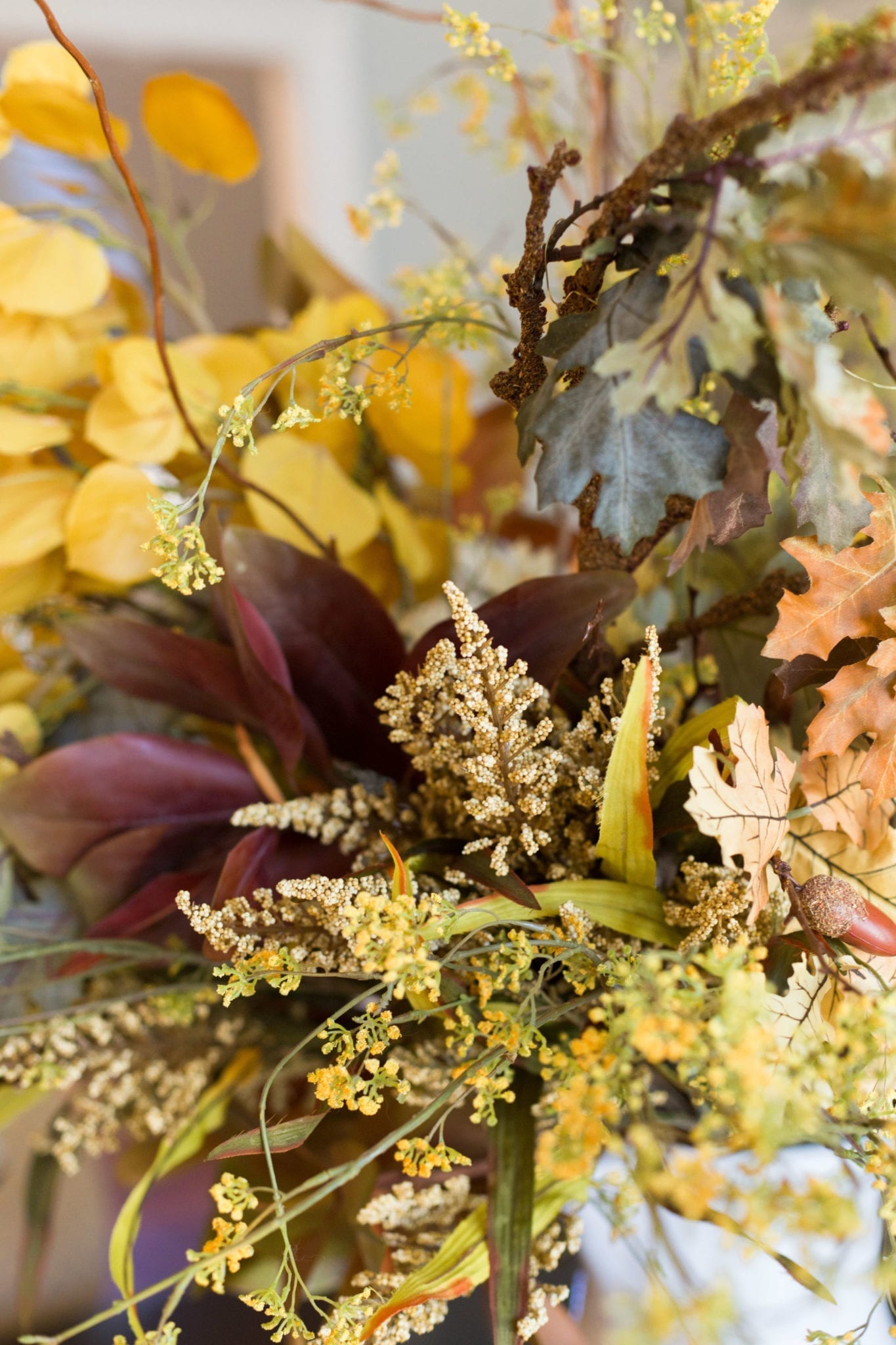 Fall flower decorations in a fall centerpiece for your dining room.