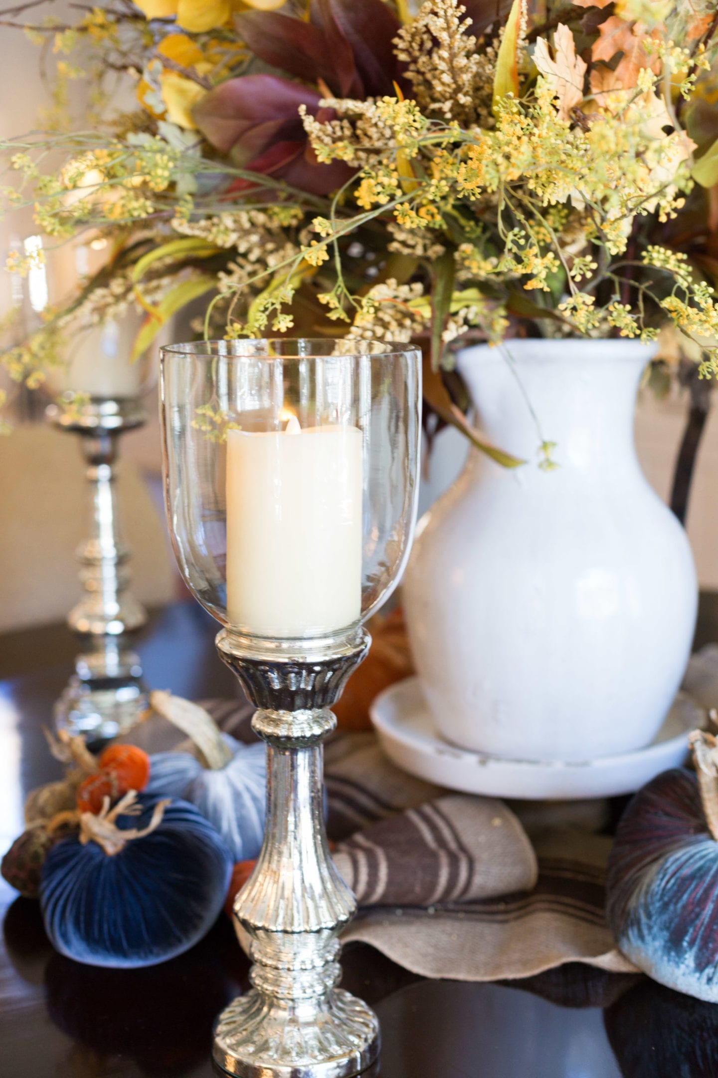 Mercury Glass Candlestick with fake candlelight. An elegant and rustic fall centerpiece made of autumn flower arrangements! This is a great silk flower arrangements for dining room table.
