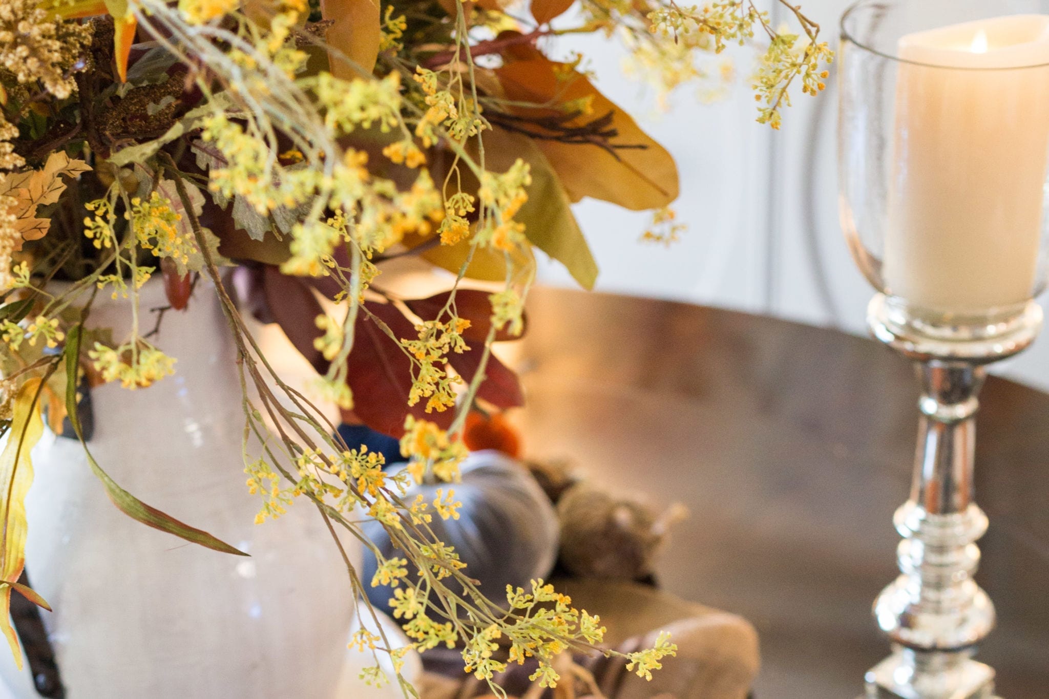 Gorgeous fall flowers and mercury glass candles.