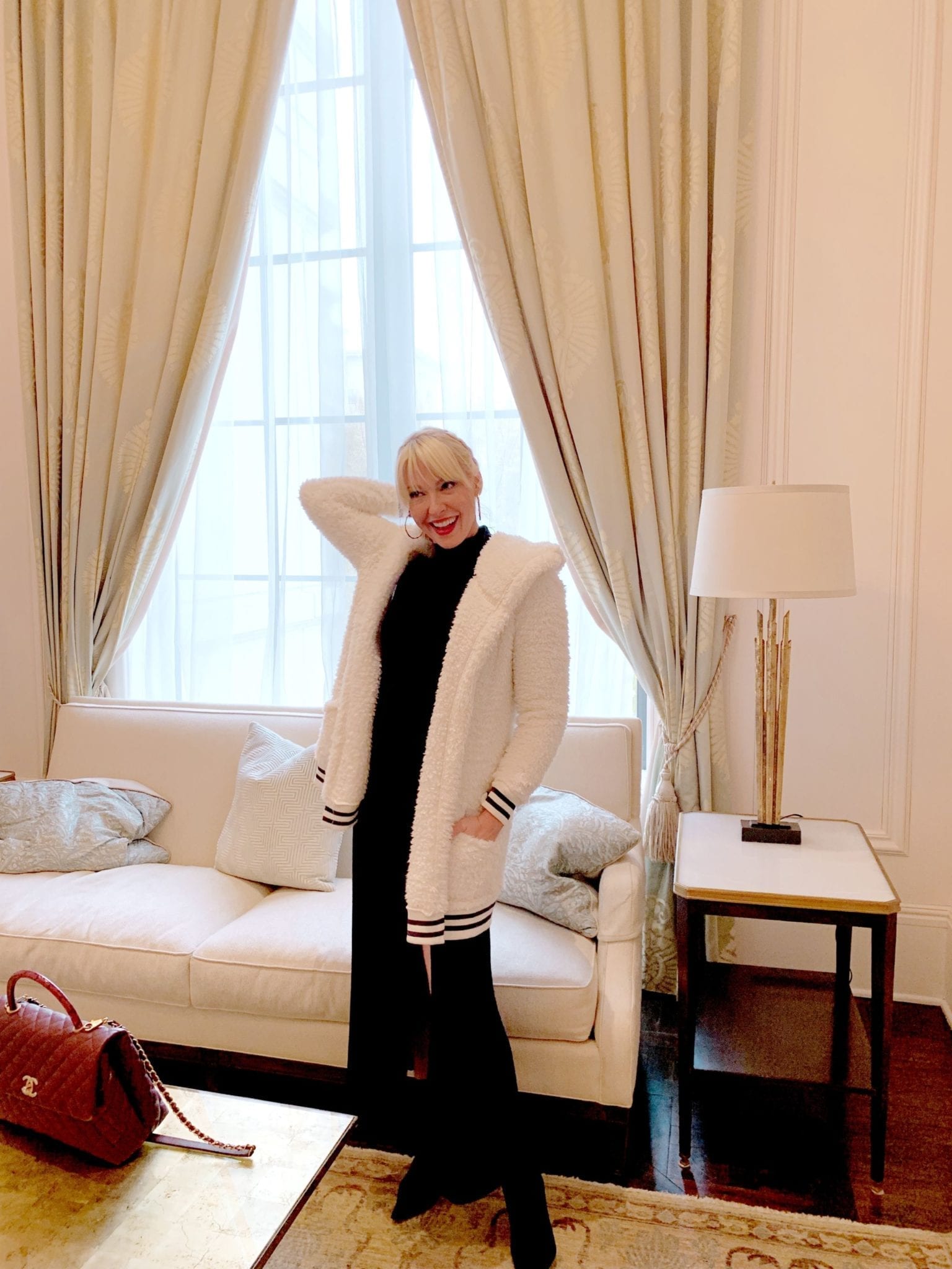 Cozy White Sweater Jacket from Make and Model with black long sleeve dress.