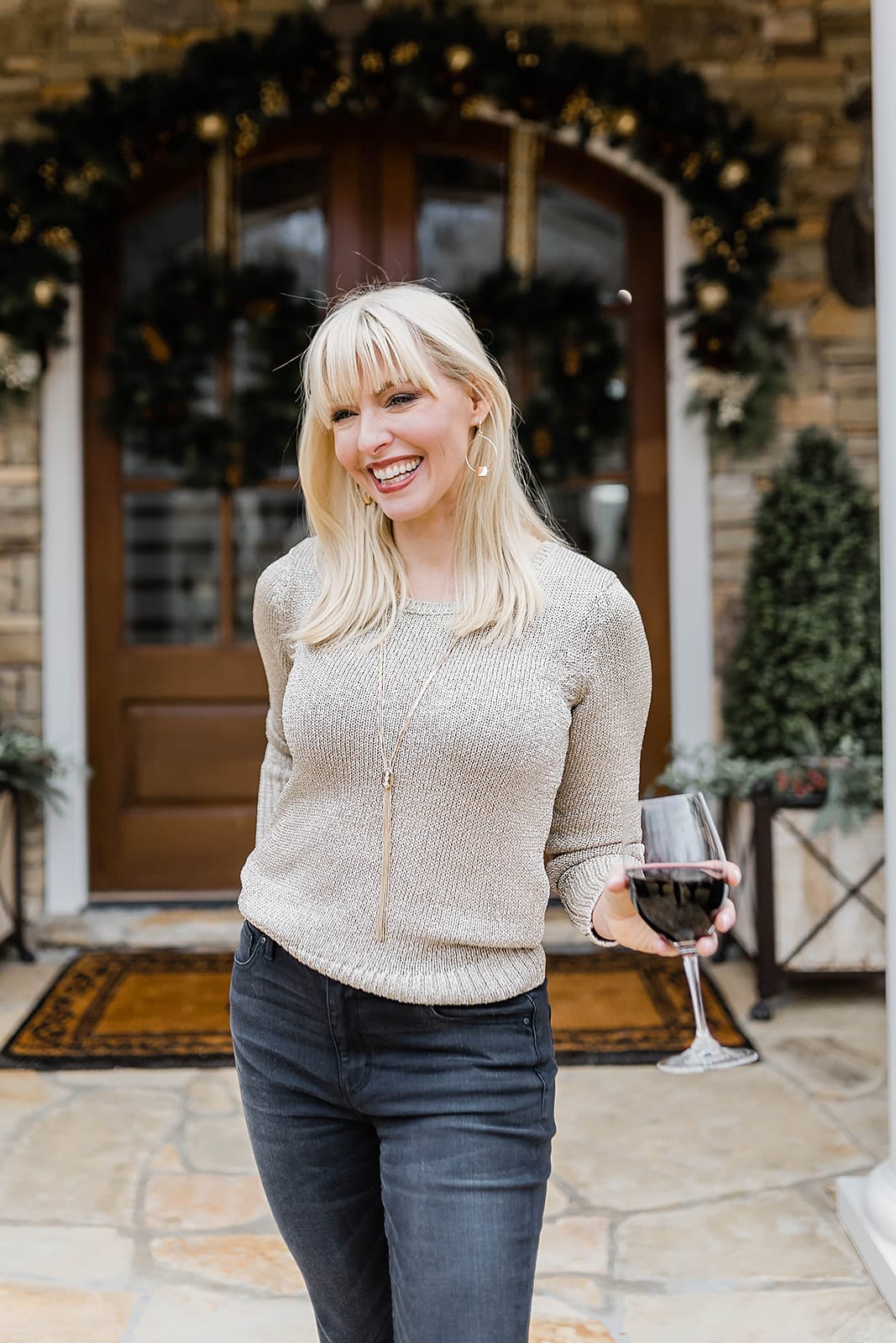 Easy NYE Outfit with black high rise jeans and shimmery sweater.