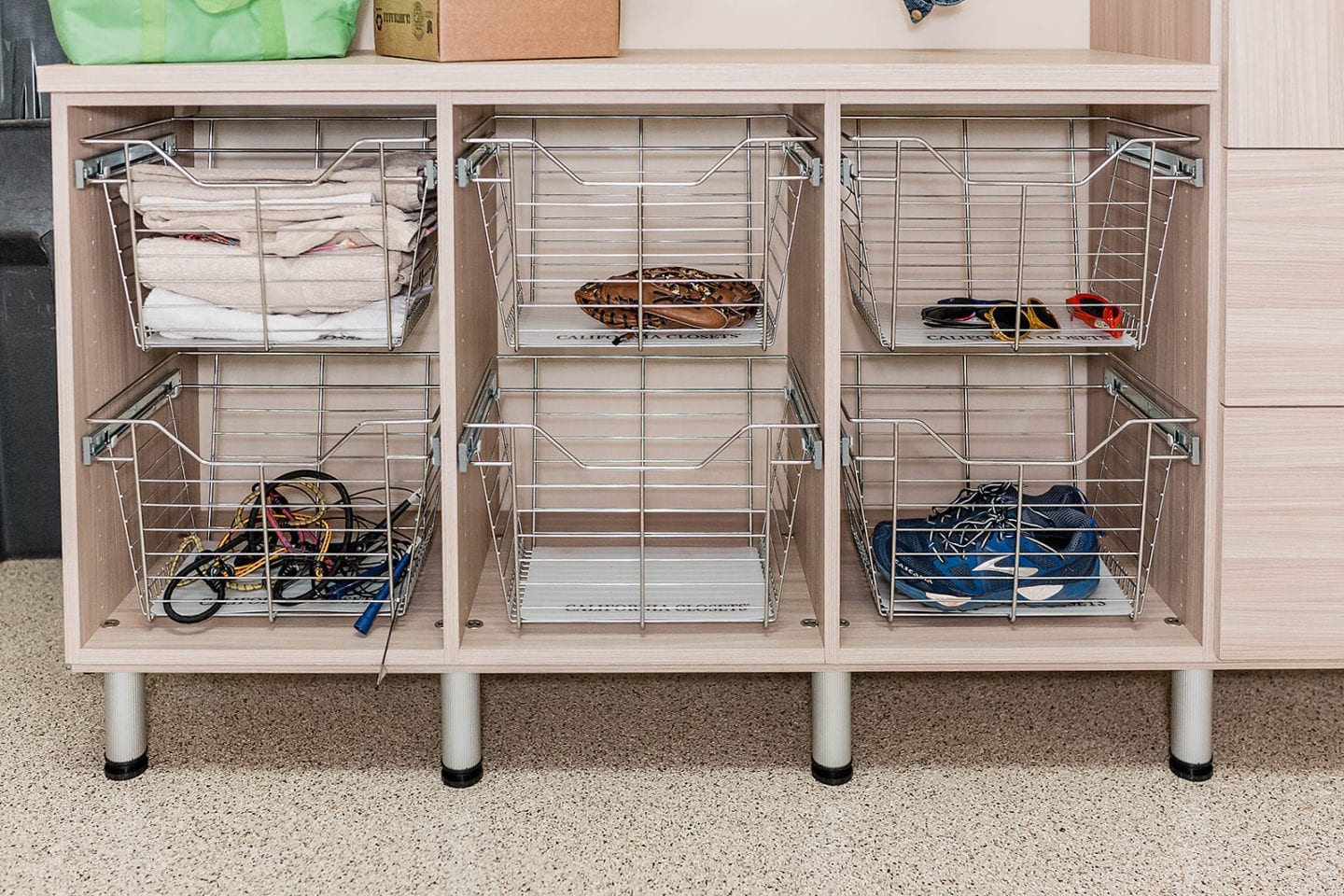 Garage and Attic Organization - baskets to store gym equipment and junk in your garage. Creative ways to keep things organized!