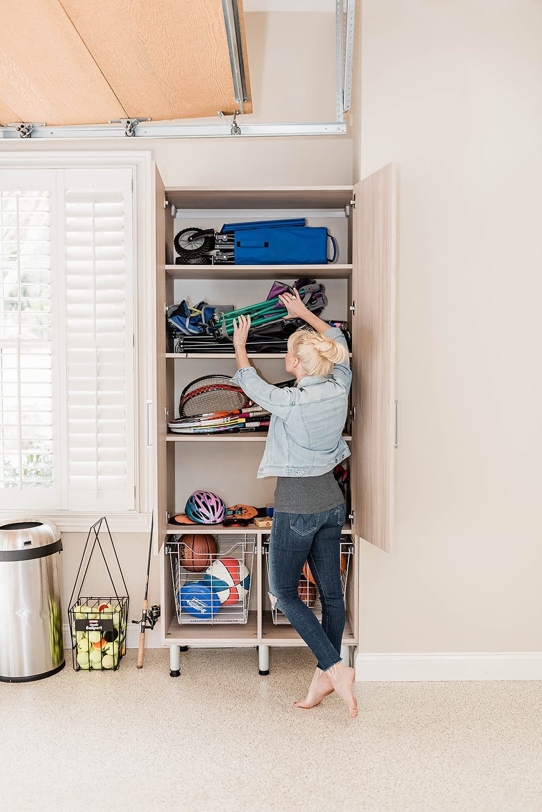 Garage organization cabinets made by California Closets. Tips for building custom cabinetry for organizing your garage.